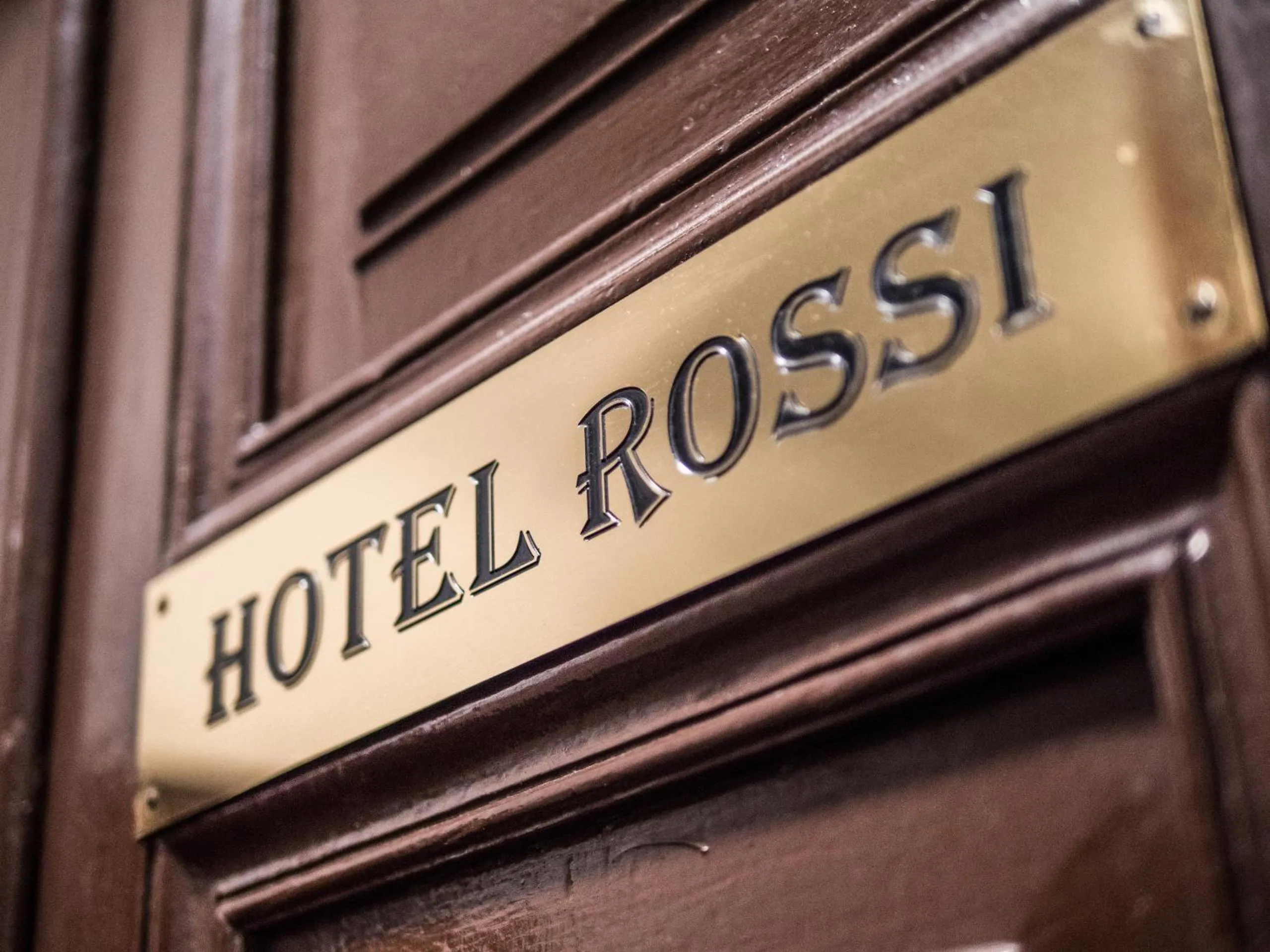 Property logo or sign in Rossi Hotel