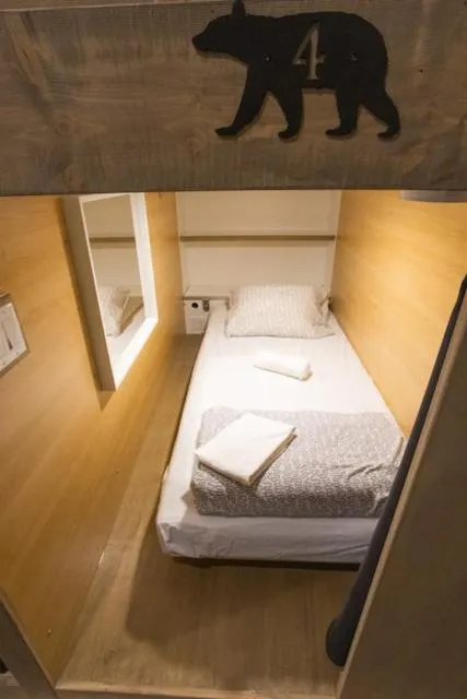 Bed in The Raging Elk Adventure Lodging