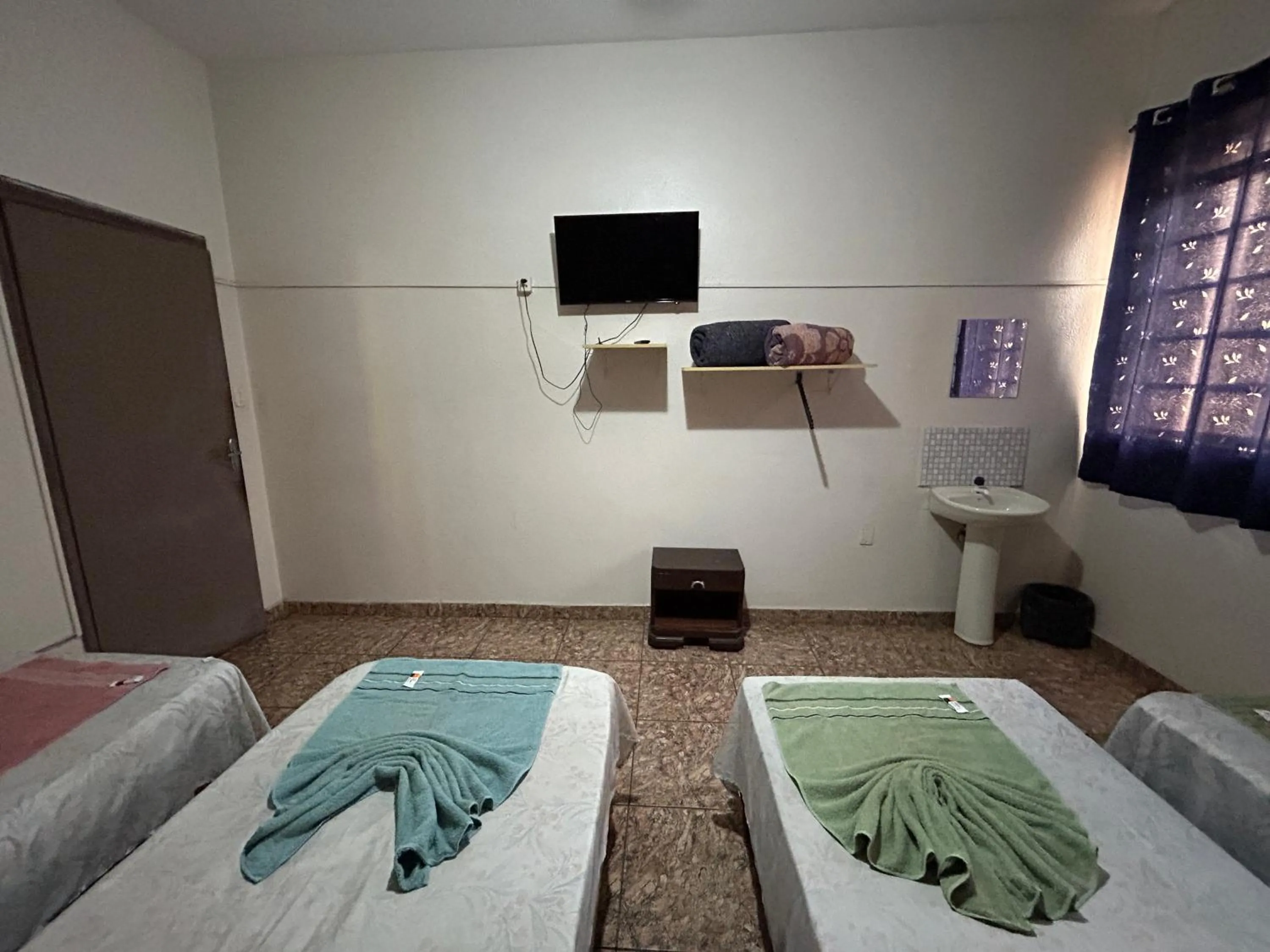 Economy Quadruple Room with Shared Bathroom - single occupancy in Hotel Santa Marta