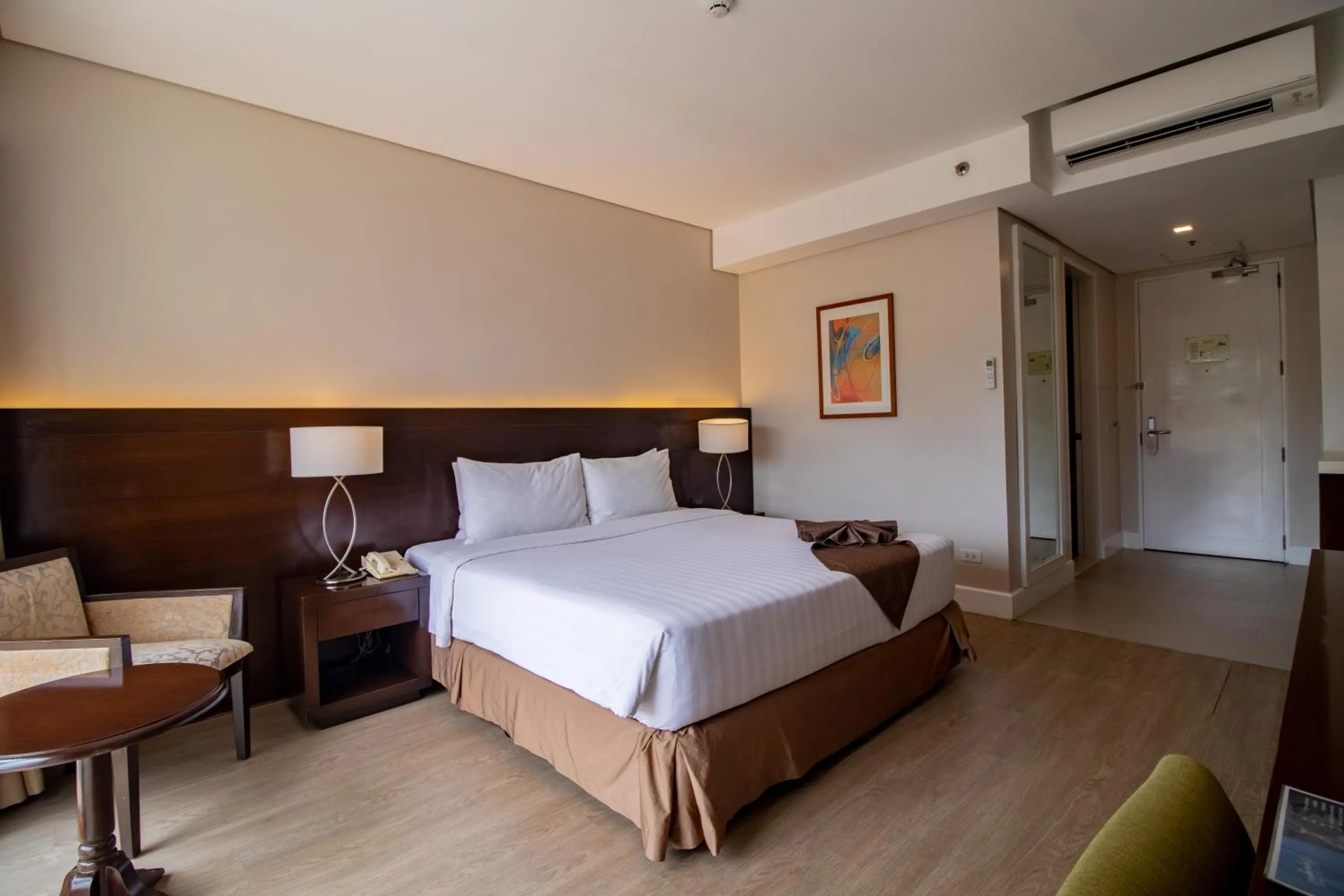 Photo of the whole room, Bed in Harolds Hotel Cebu