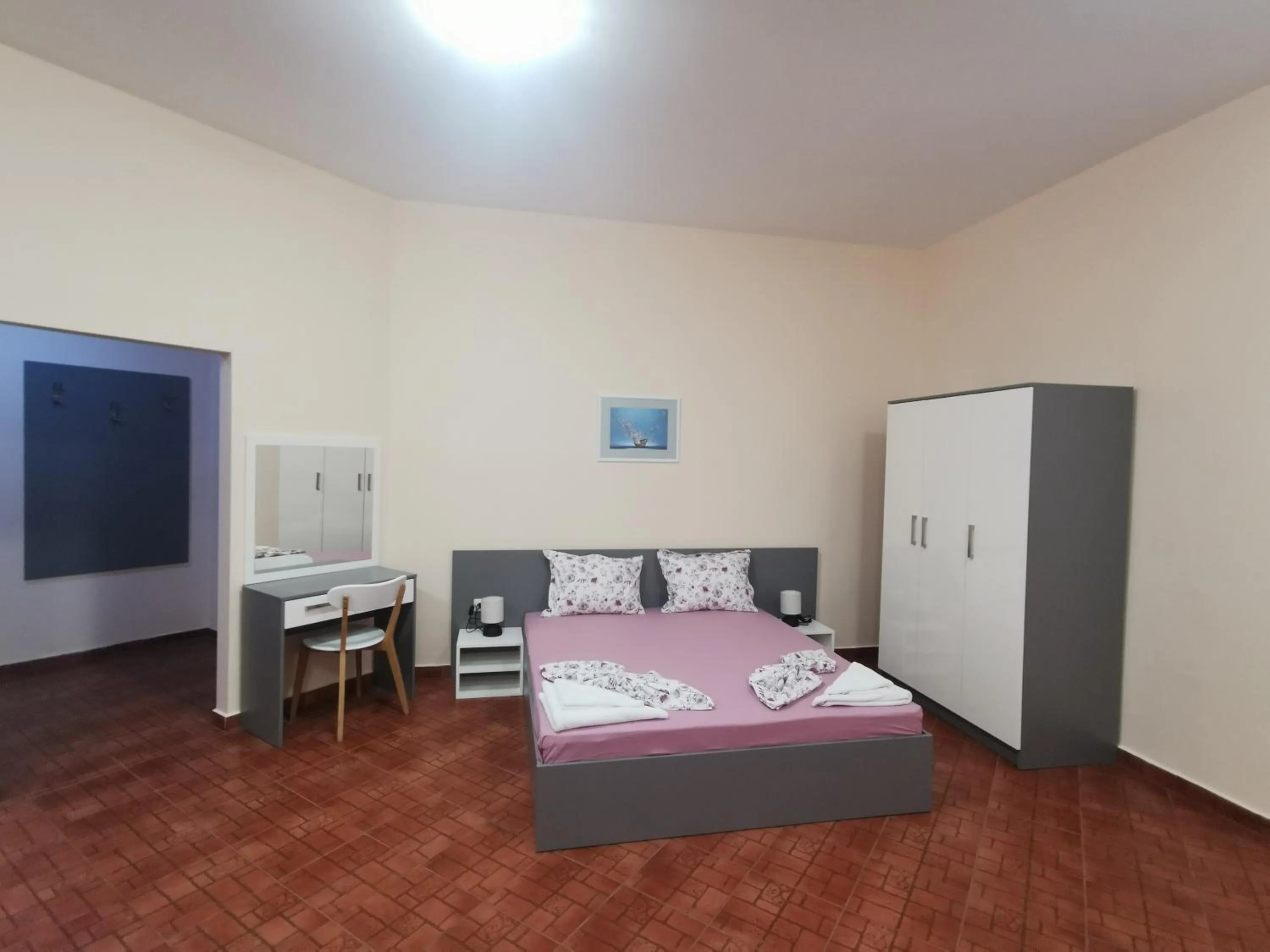 Bed in Rose Garden Omax Apartments