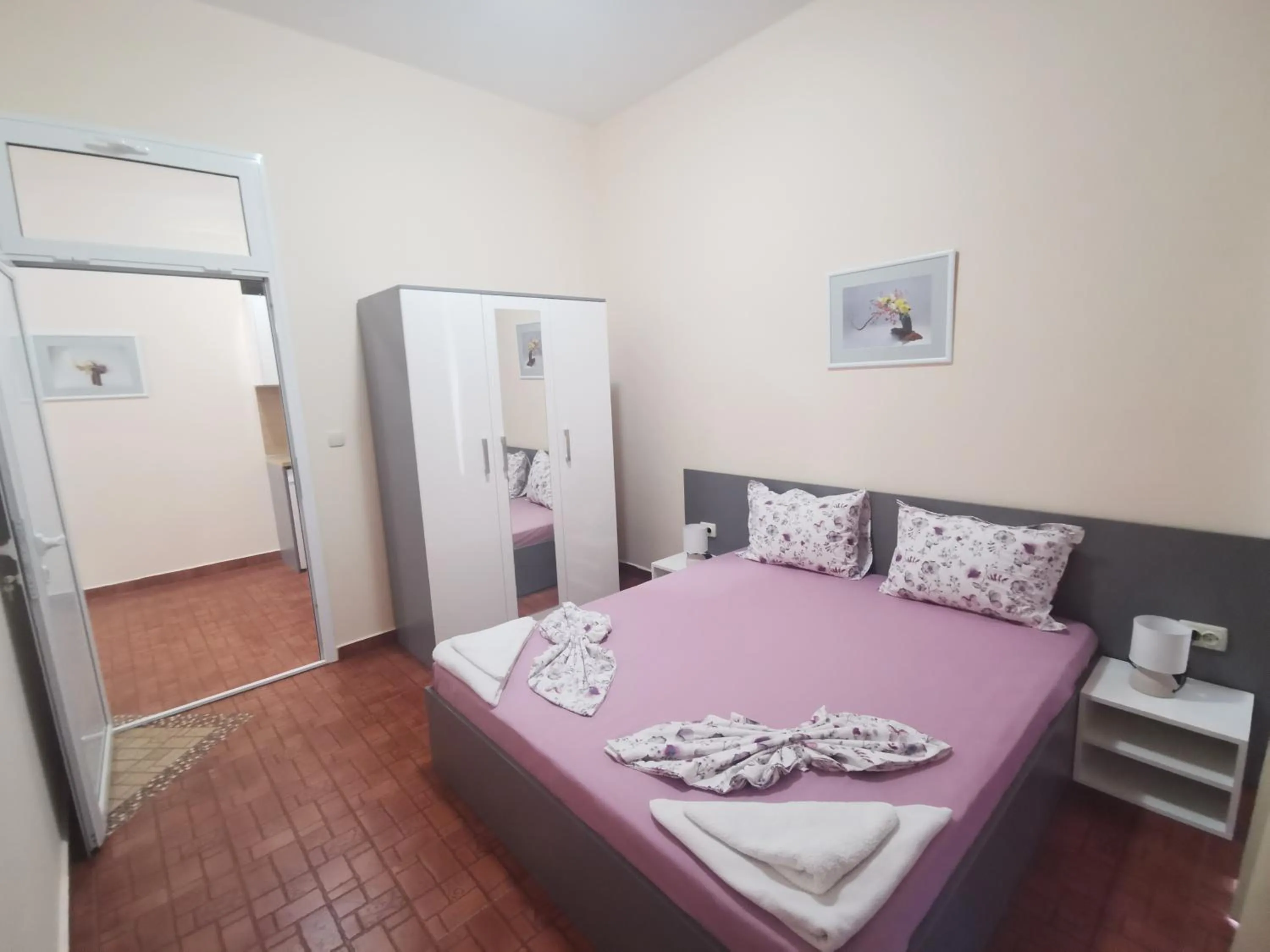 Bed in Rose Garden Omax Apartments