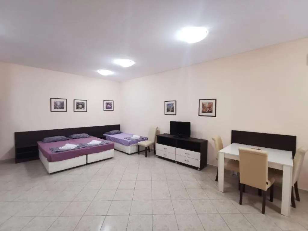 Bed in Rose Garden Omax Apartments