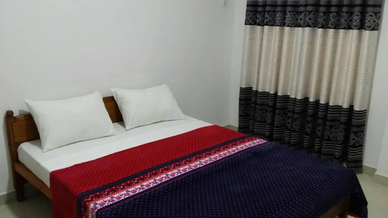 Bed in Tea Breeze Motel