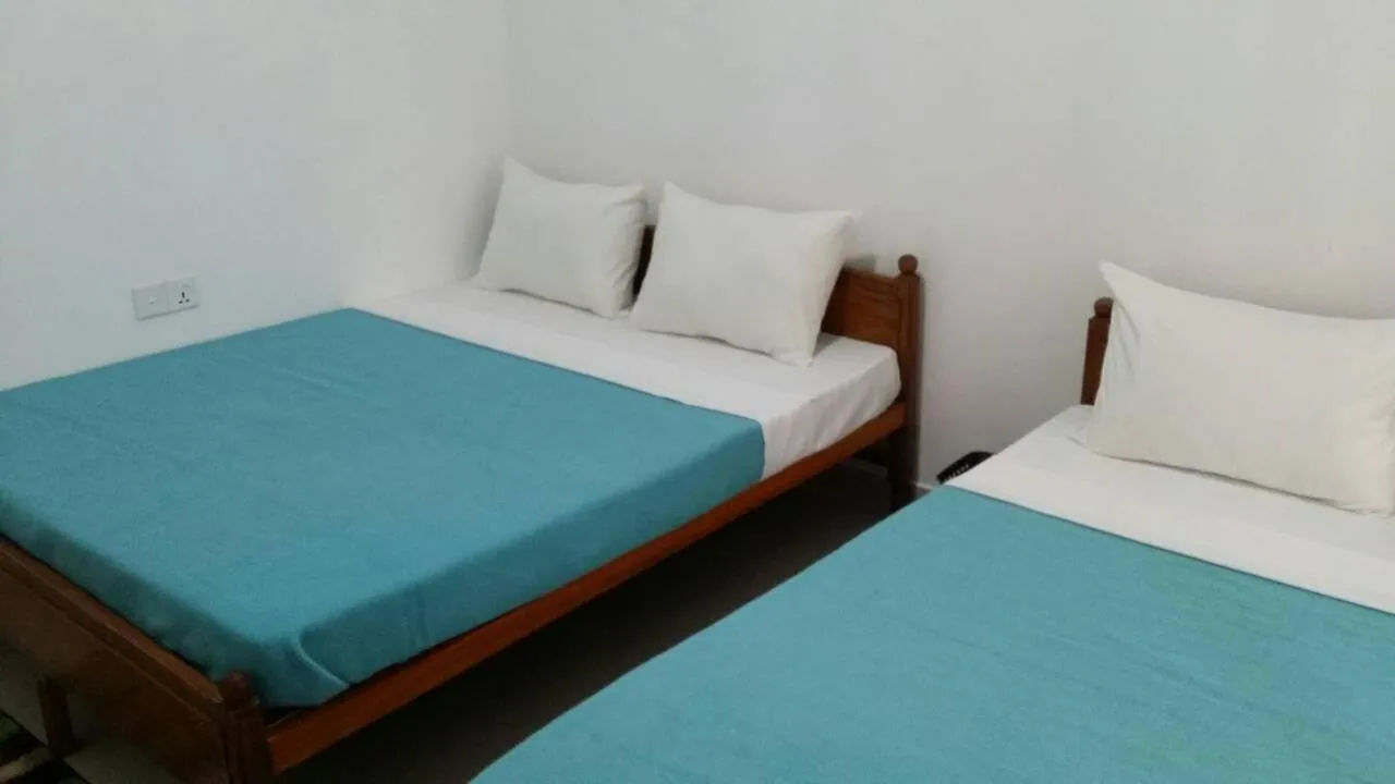 Bed in Tea Breeze Motel