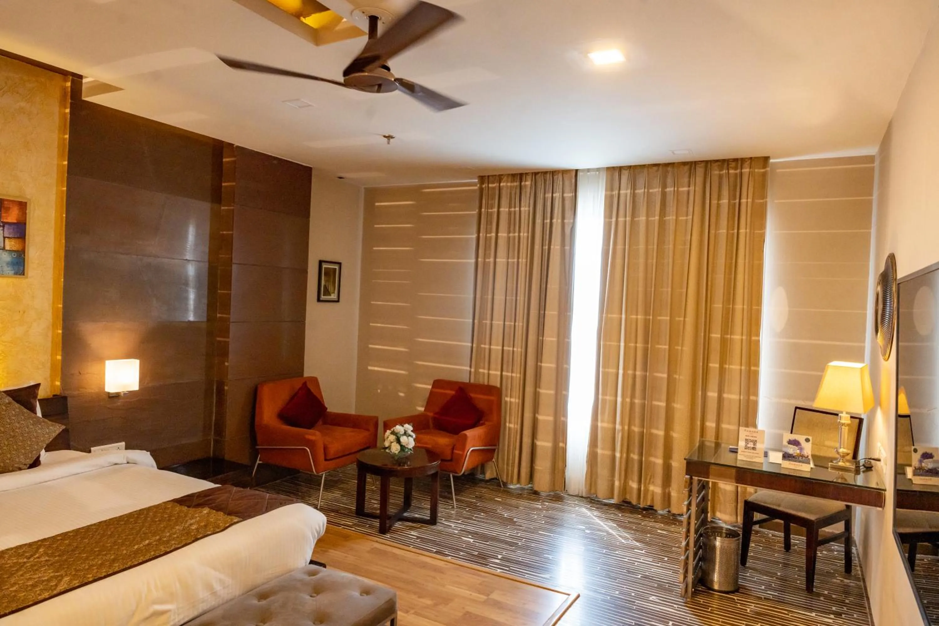 Seating area, Bed in Ramada Ajmer