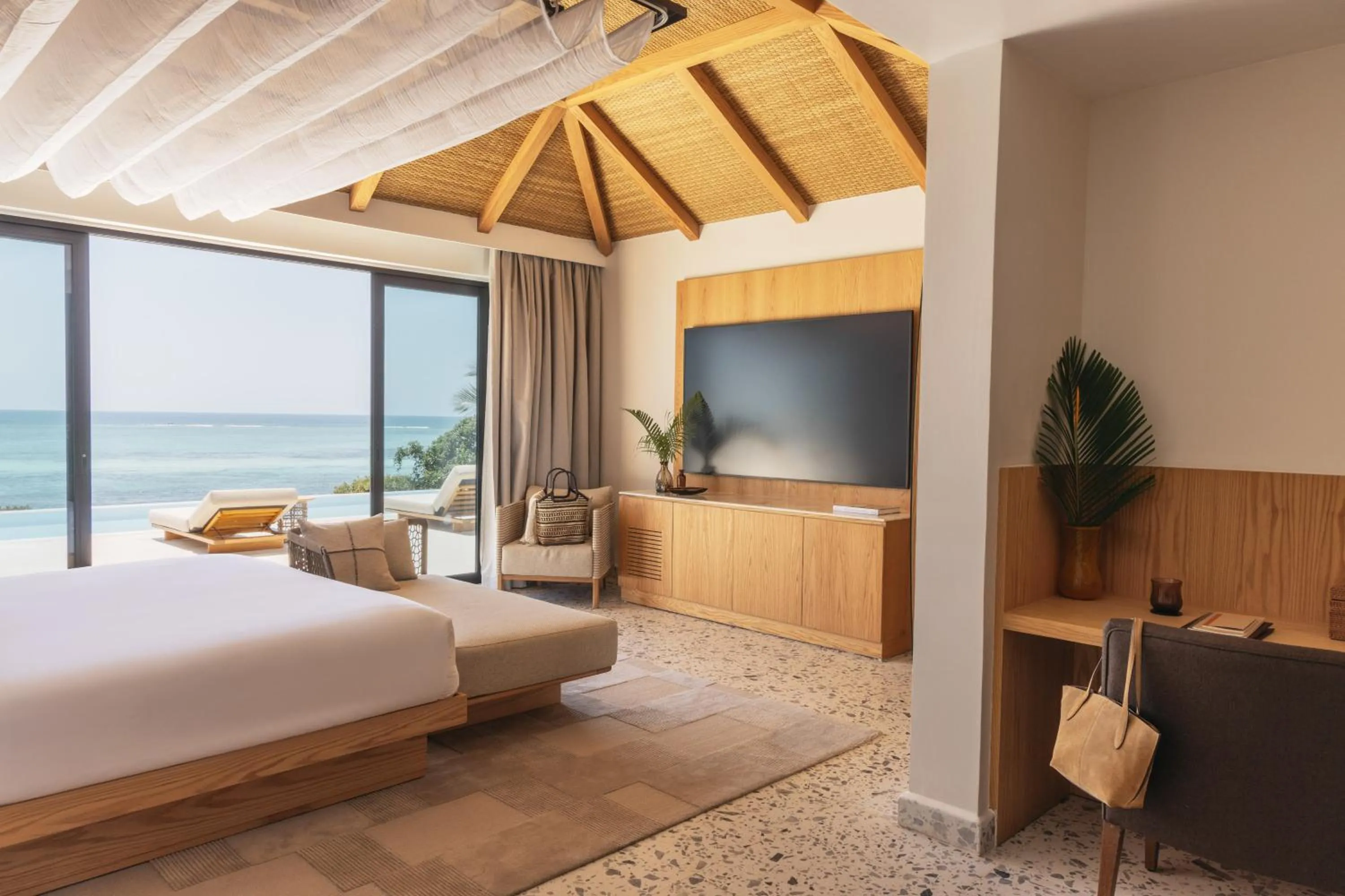 Communal lounge/ TV room, Bed in Melia Zanzibar