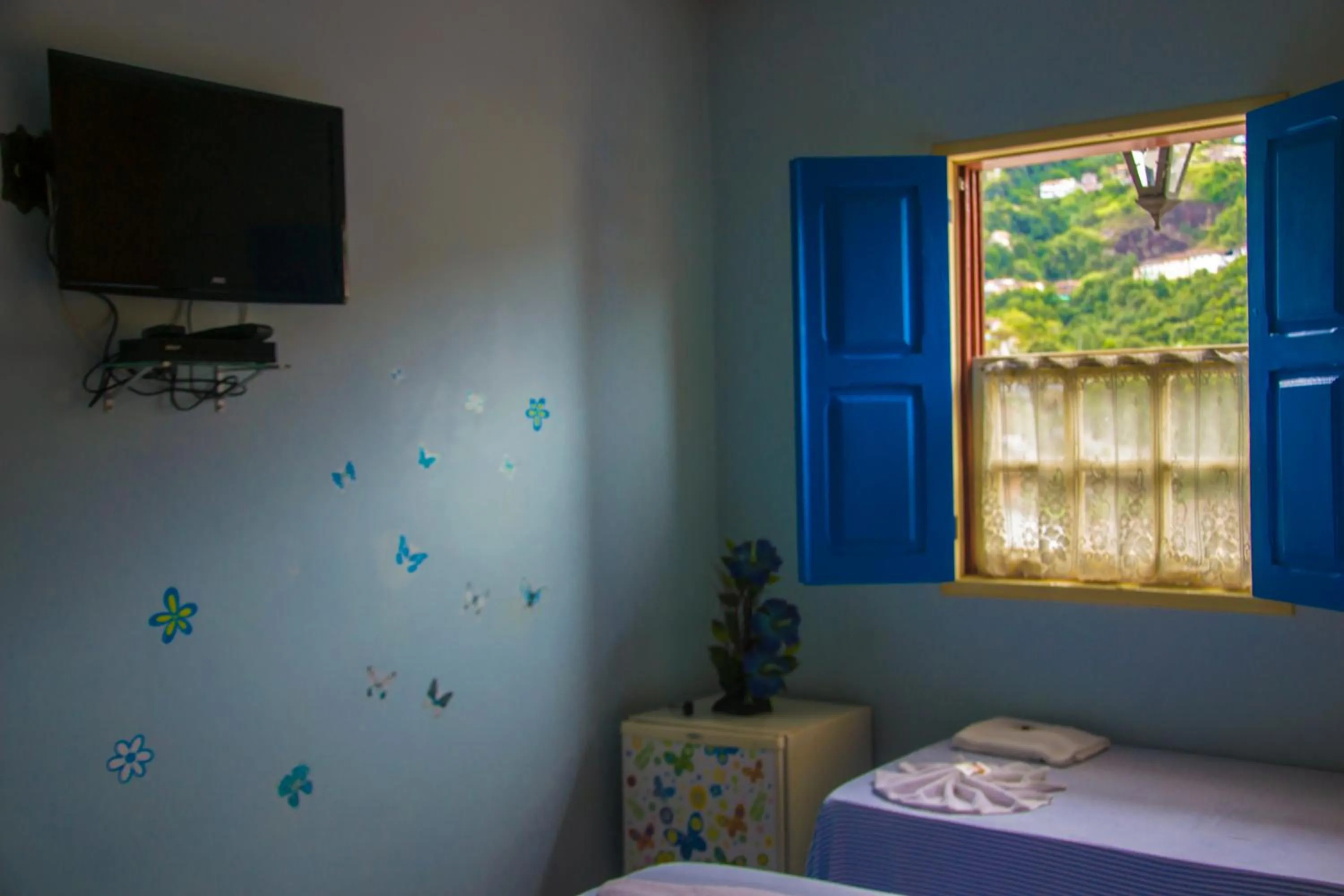 Bed in Pousada Ouro Preto