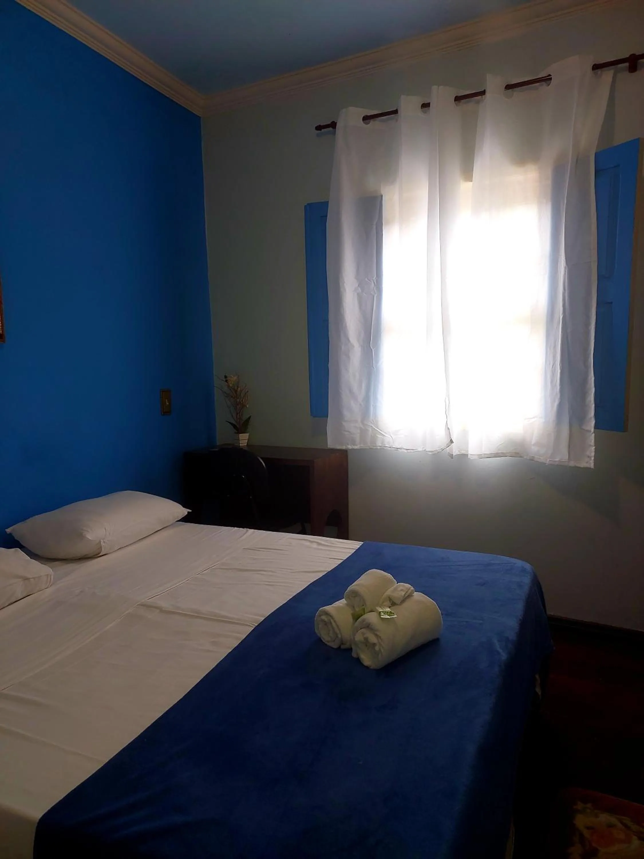 Bed in Pousada Ouro Preto