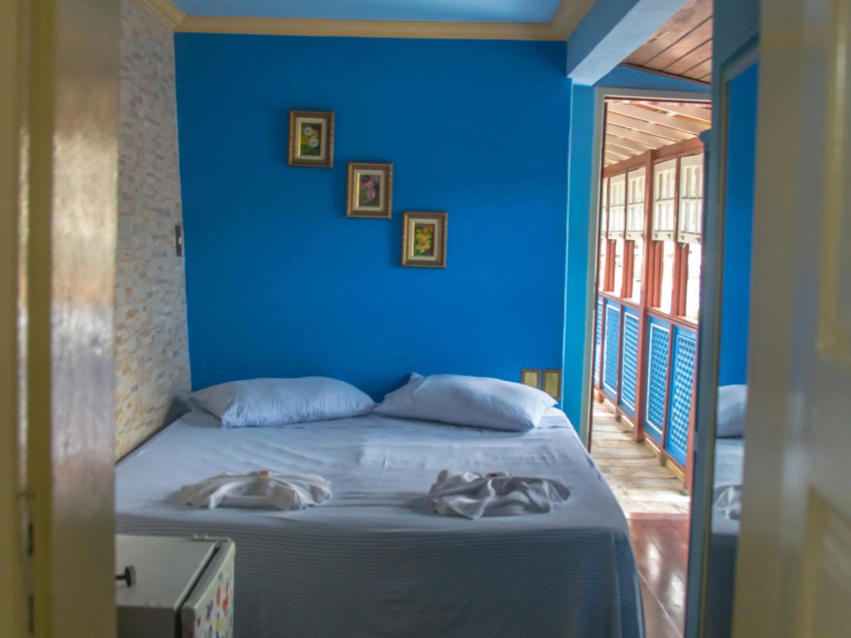 Bed in Pousada Ouro Preto