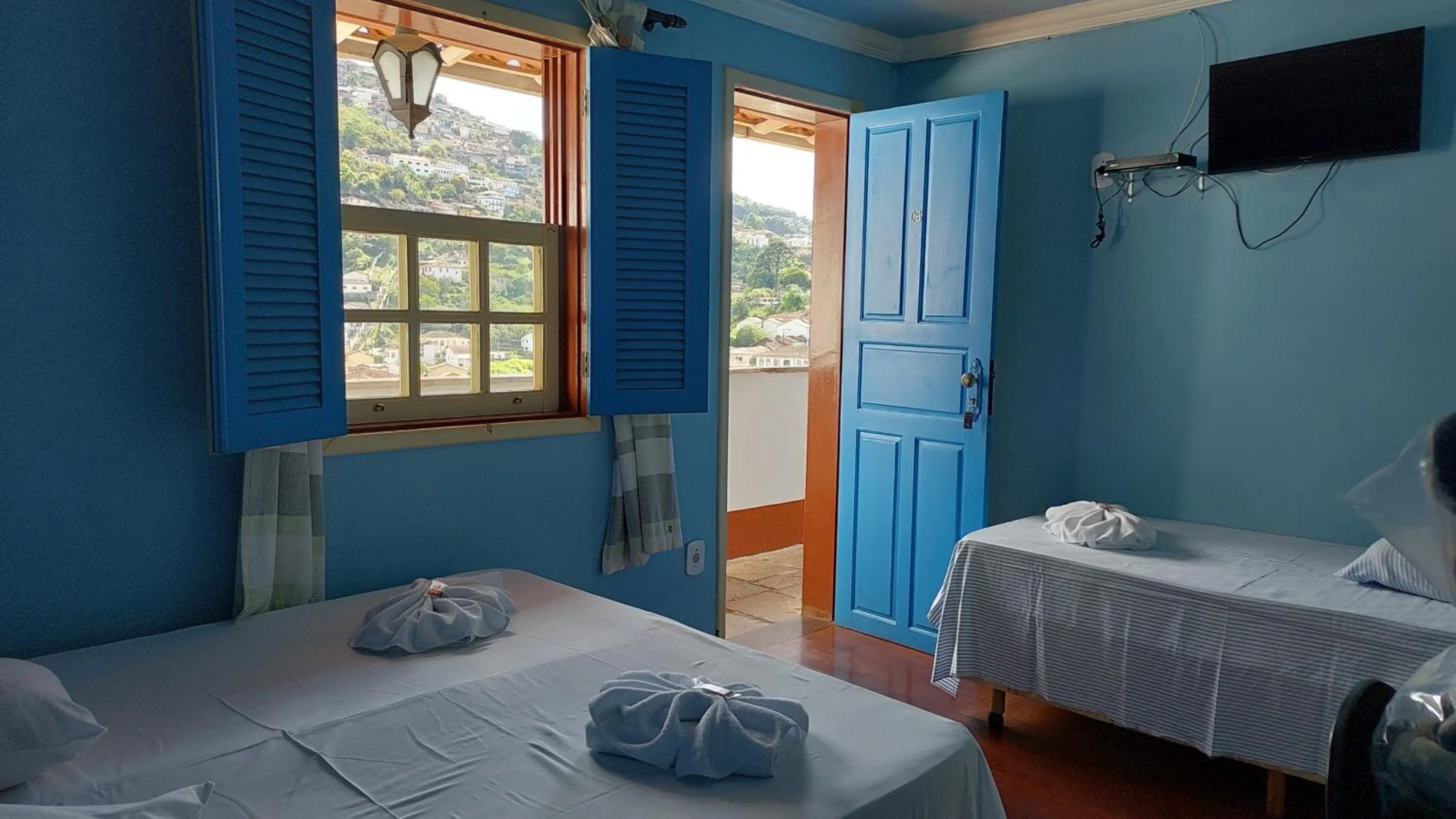 Bed in Pousada Ouro Preto