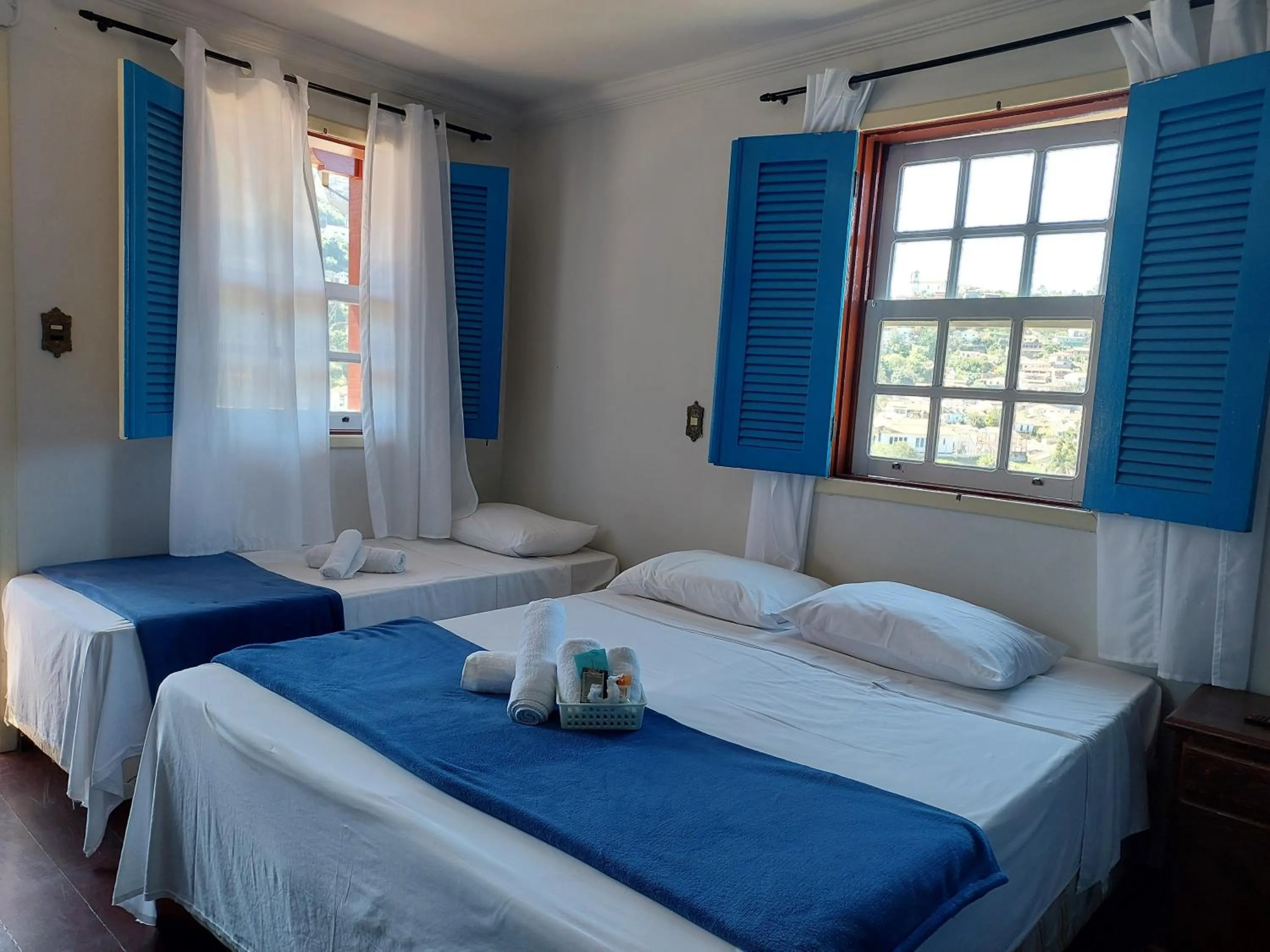 Bed in Pousada Ouro Preto