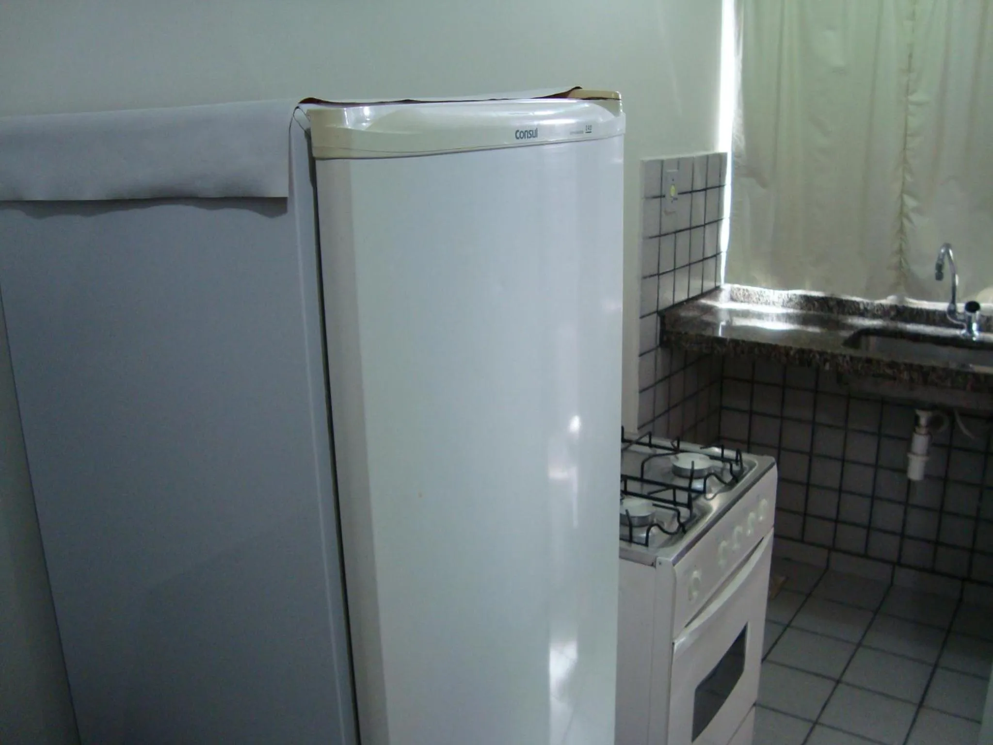 Kitchen or kitchenette in Flat Pousada da Praia