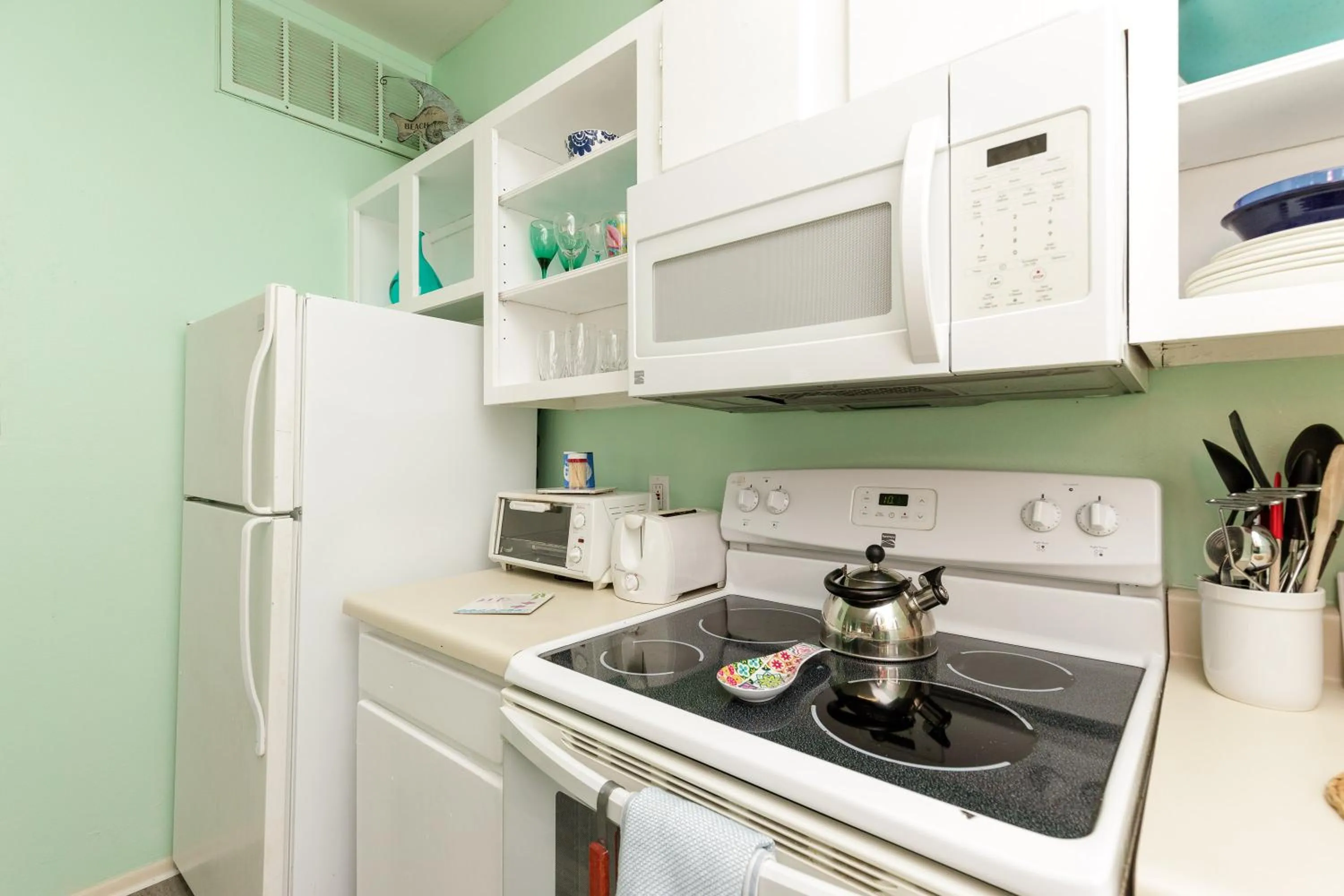 kitchen in Charming family condo - walking distance to beach by Mustang Island, Sleeps Four, 2025 Traveler Award