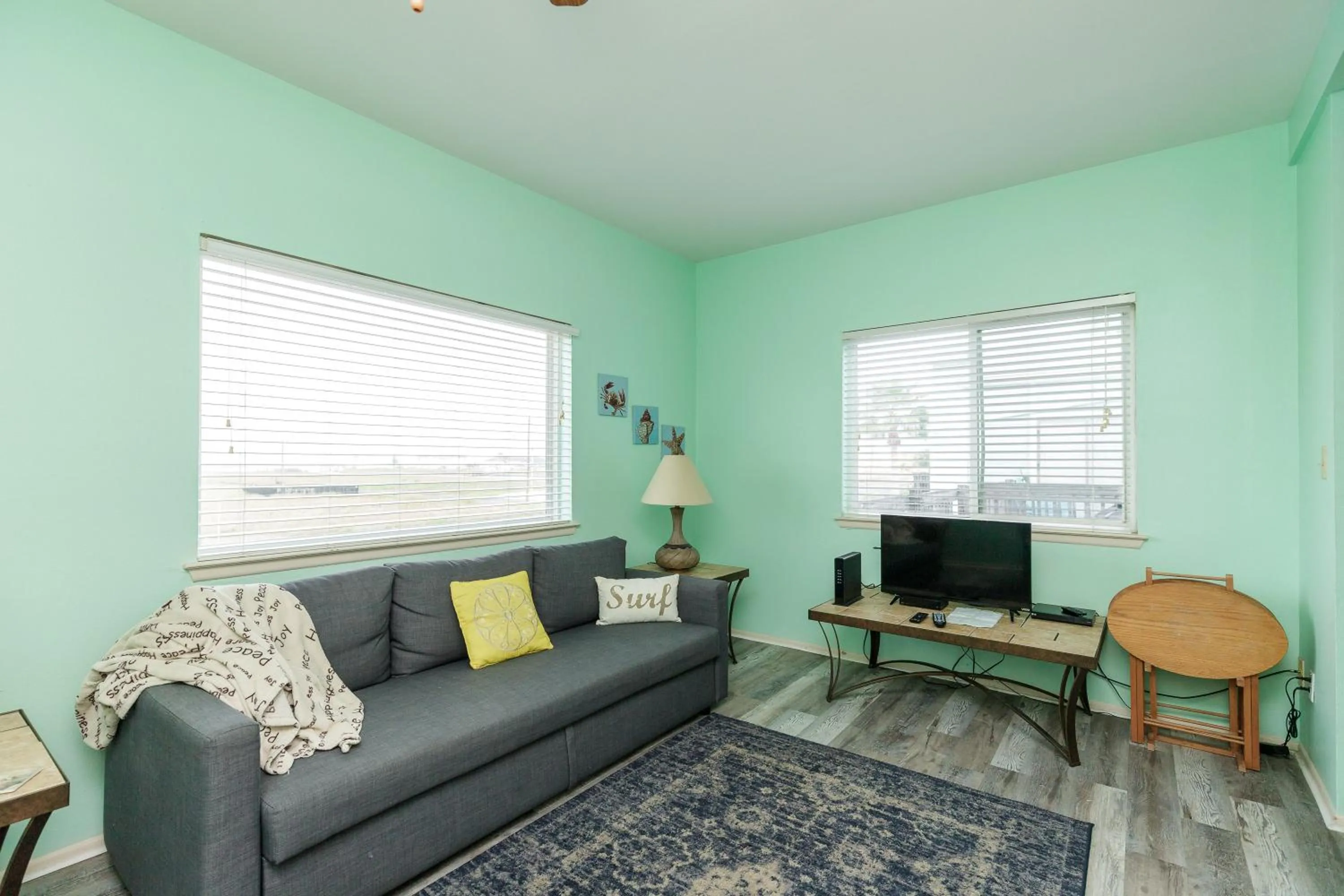 Living room in Charming family condo - walking distance to beach by Mustang Island, Sleeps Four, 2025 Traveler Award