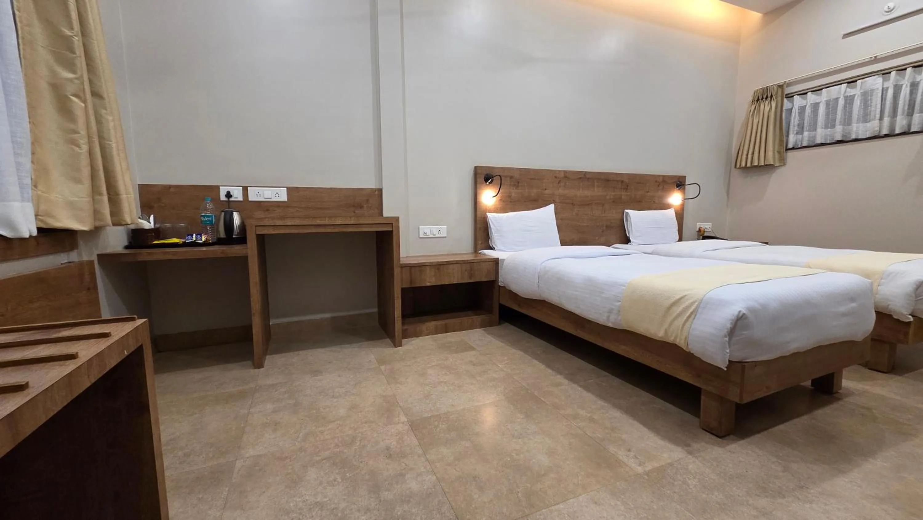 Photo of the whole room, Bed in Hotel Gulmohar Grand