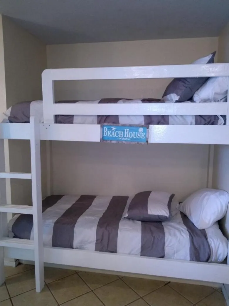 bunk bed, Bed in Charming SPI family condo - walking distance to the beach, Sleeps 6, Third Floor, 2025 Traveler Award
