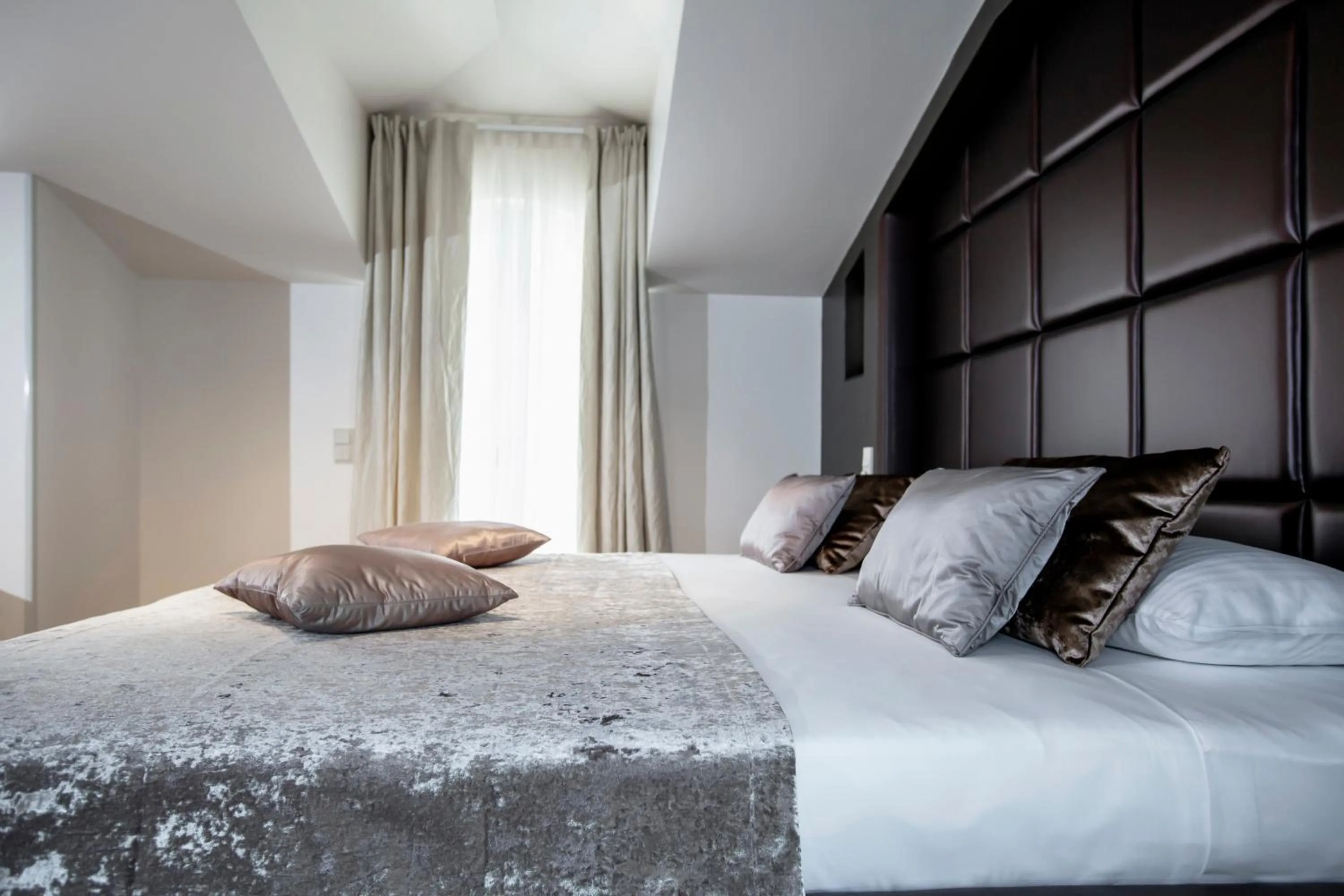 Bed in Damianii Luxury Boutique Hotel & Spa