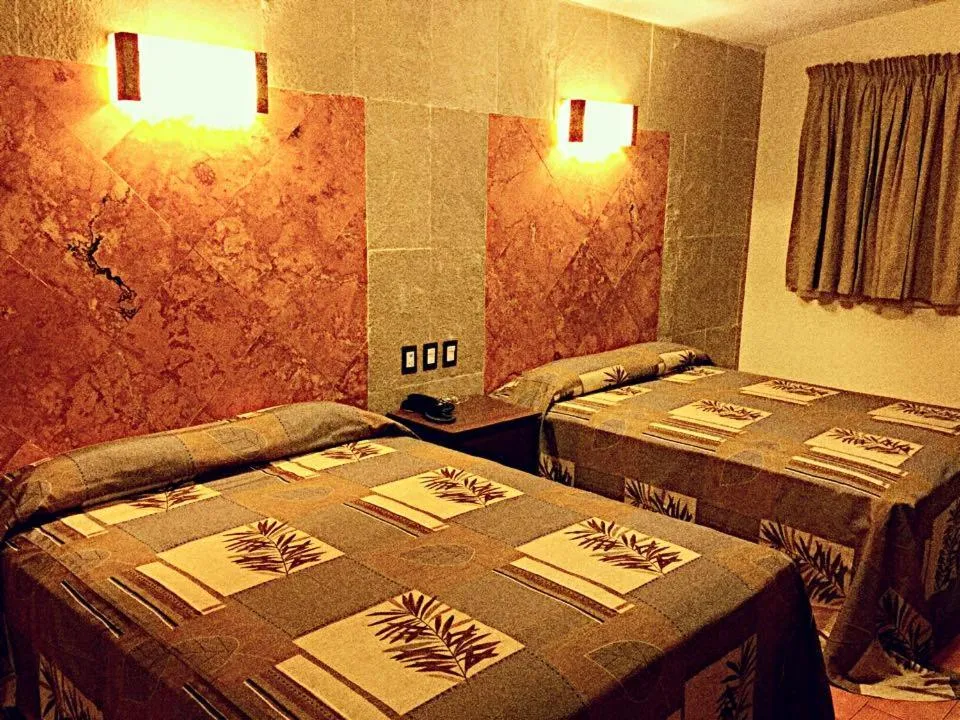 Quadruple Room with Garden View in Hotel & Motel Hacienda Jiutepec