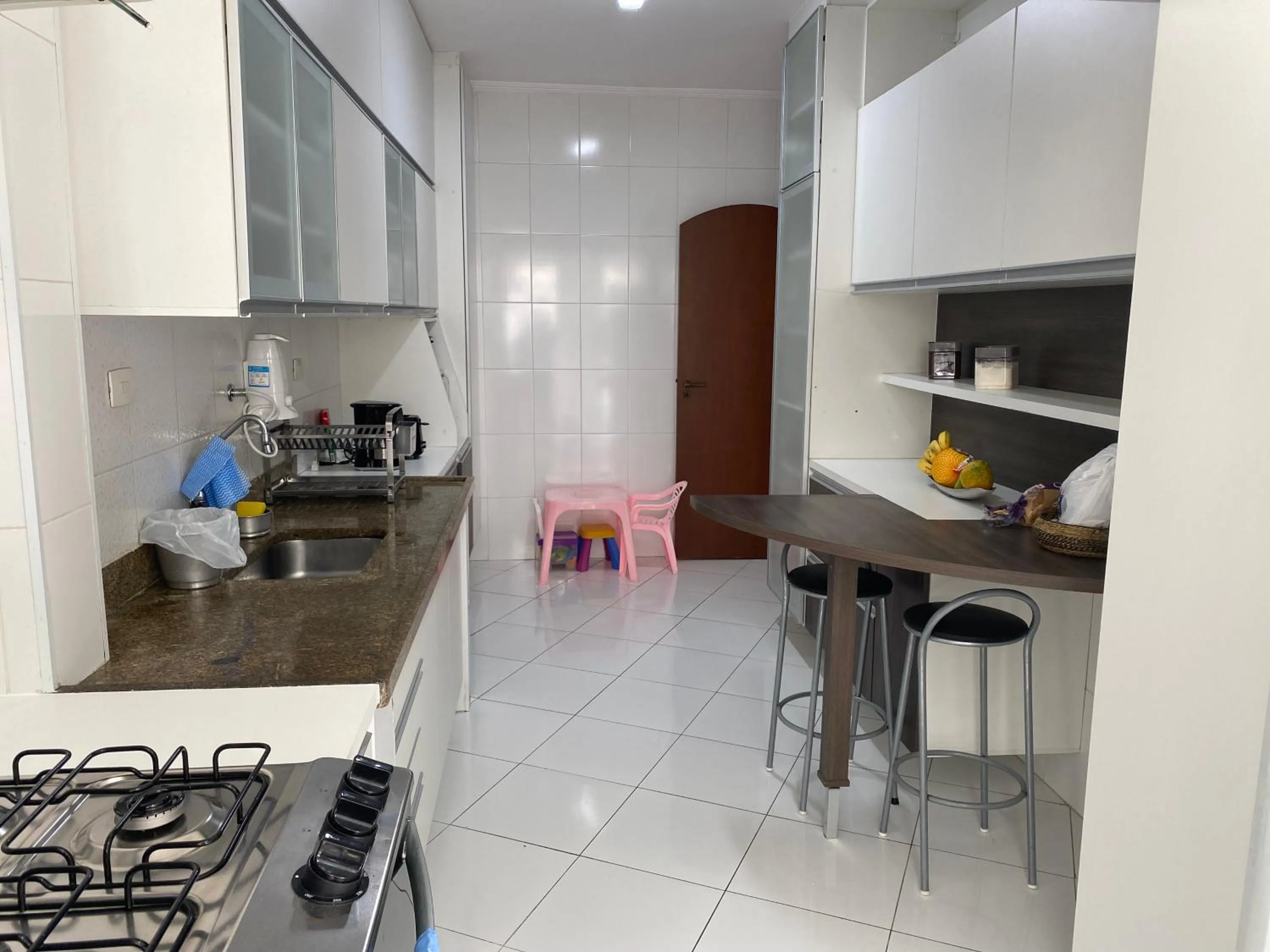 kitchen in Apto praia do Tombo - Guarujá