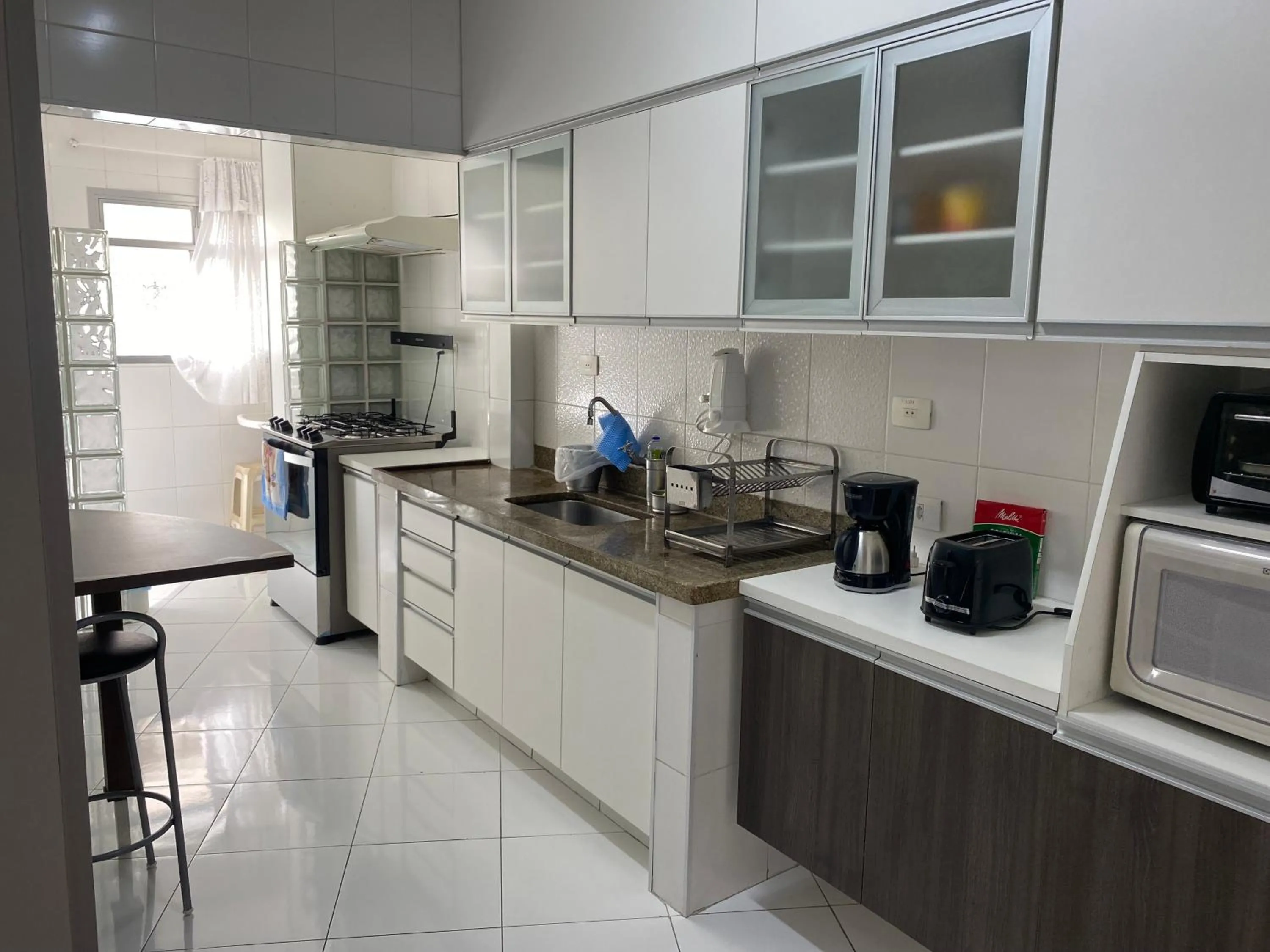kitchen in Apto praia do Tombo - Guarujá