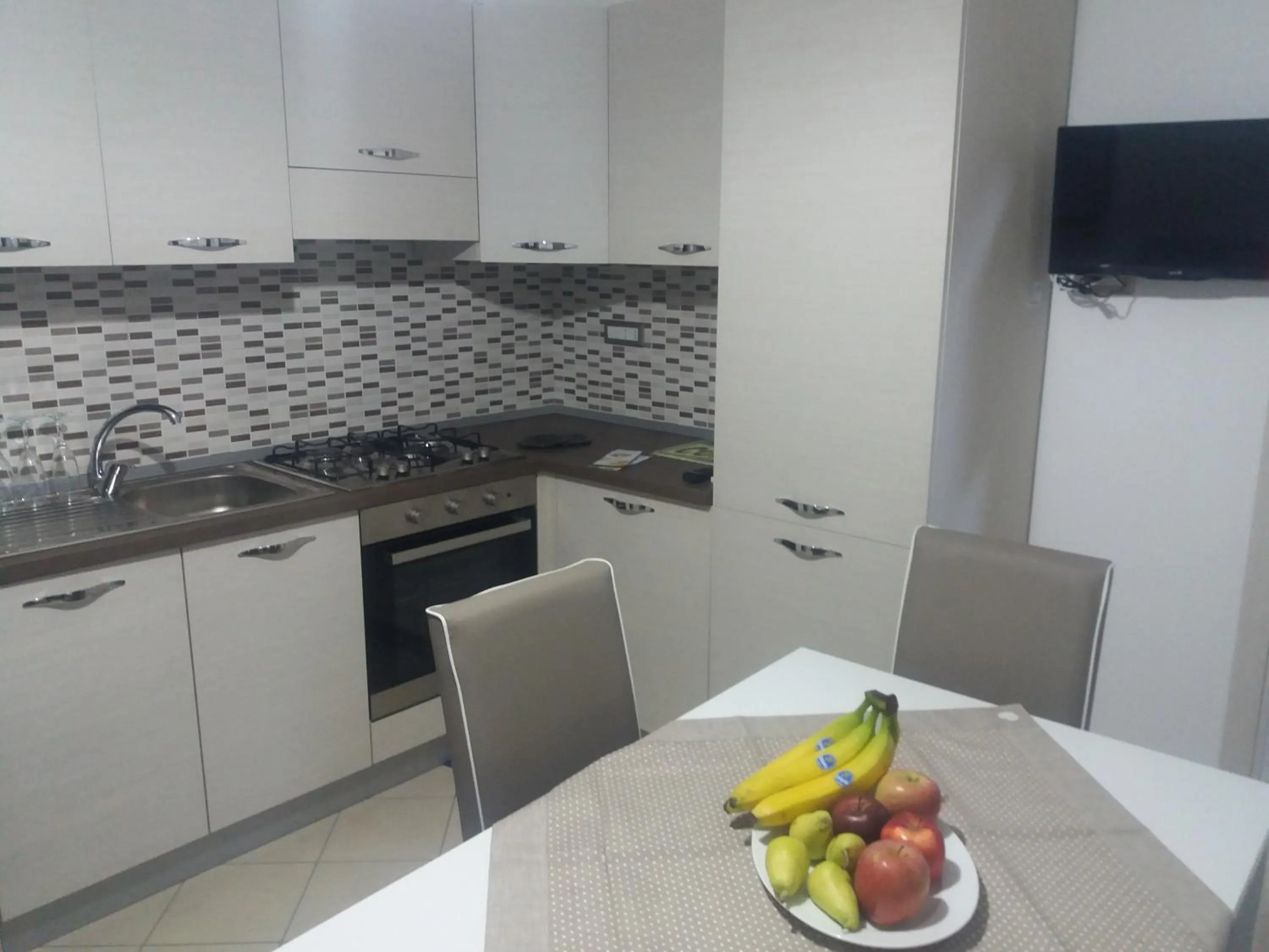 Kitchen or kitchenette in Appartamento B&B Domus Pompei