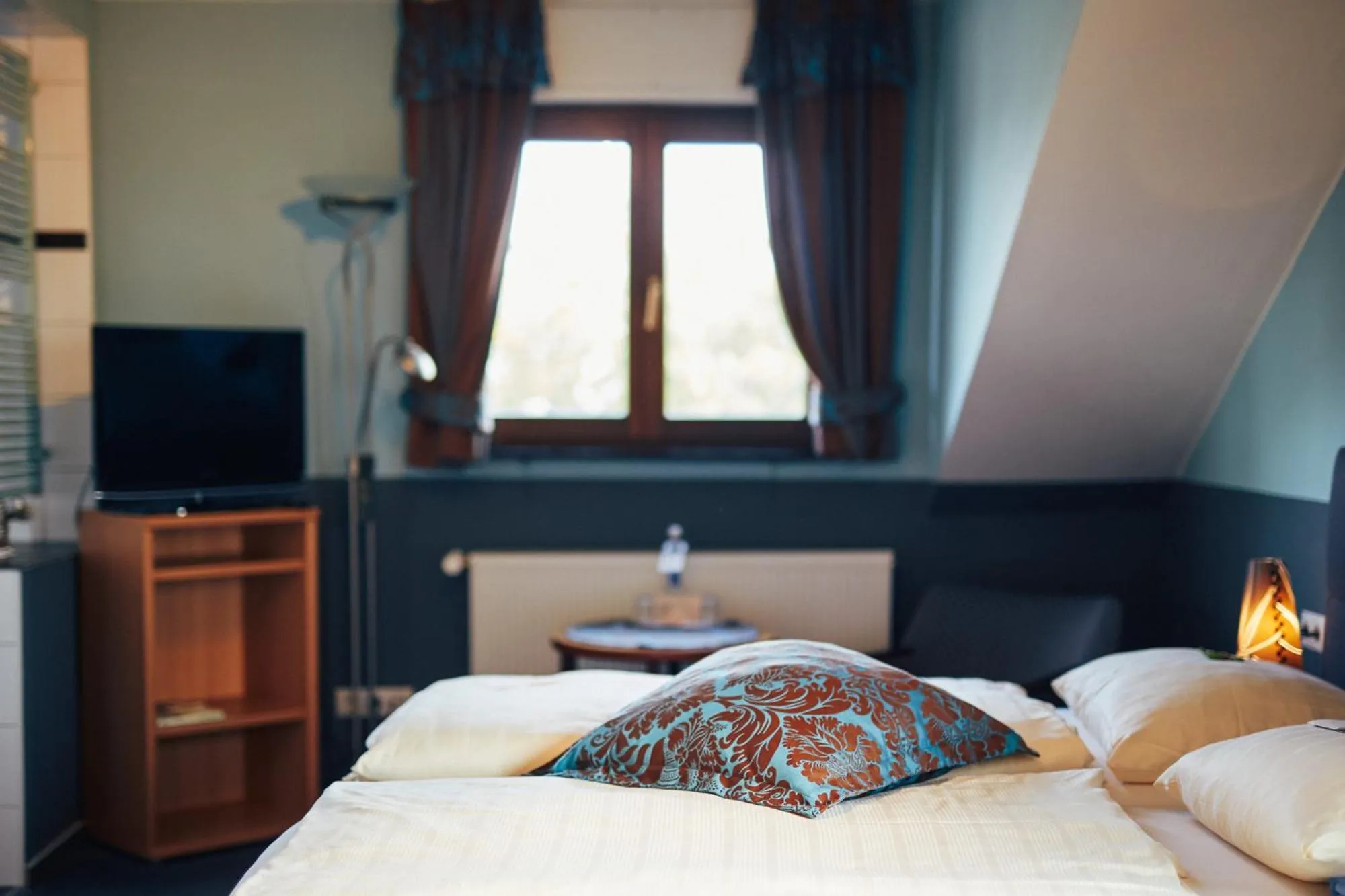 Photo of the whole room, Bed in FETZ DAS LORELEY HOTEL