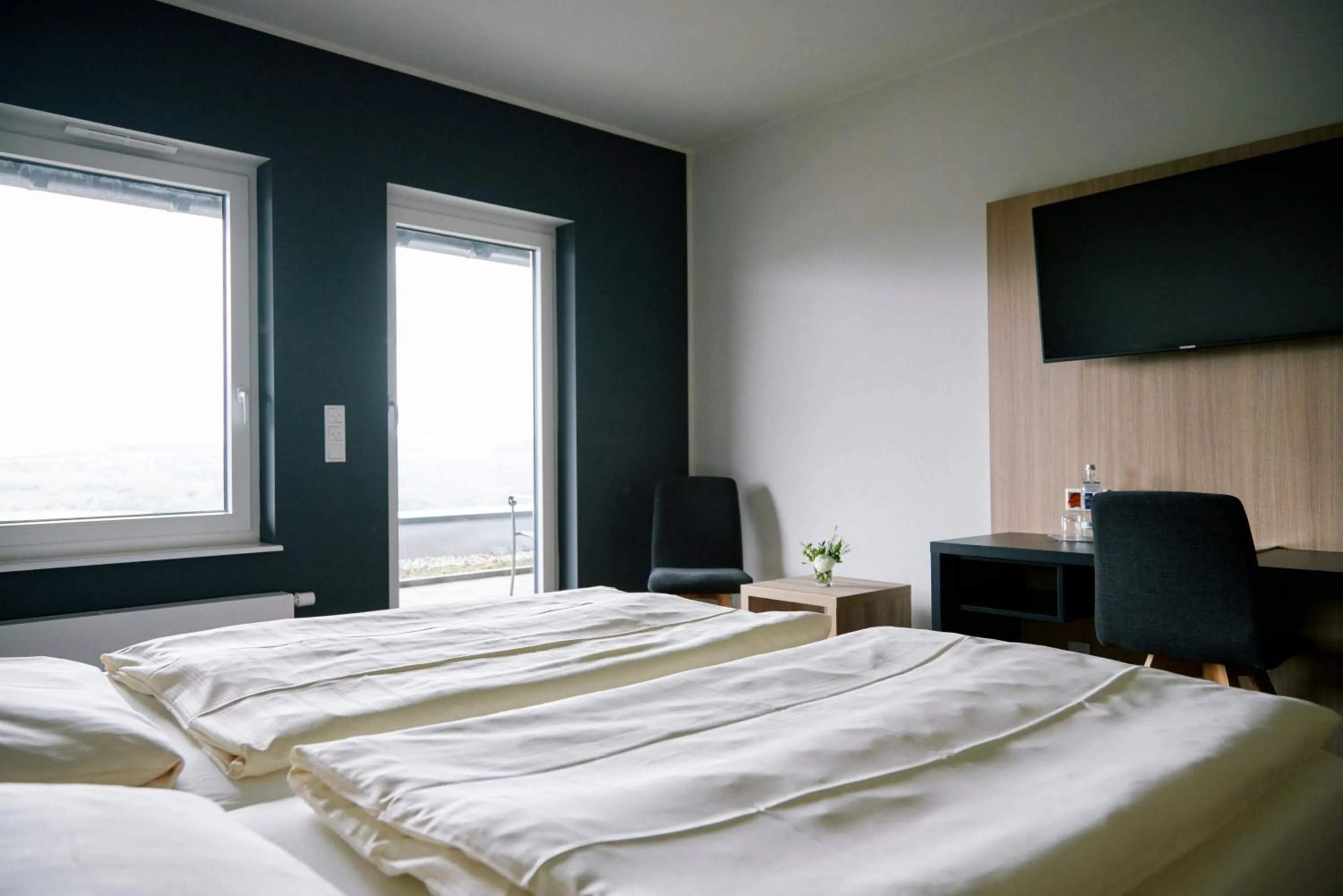 Photo of the whole room, Bed in FETZ DAS LORELEY HOTEL