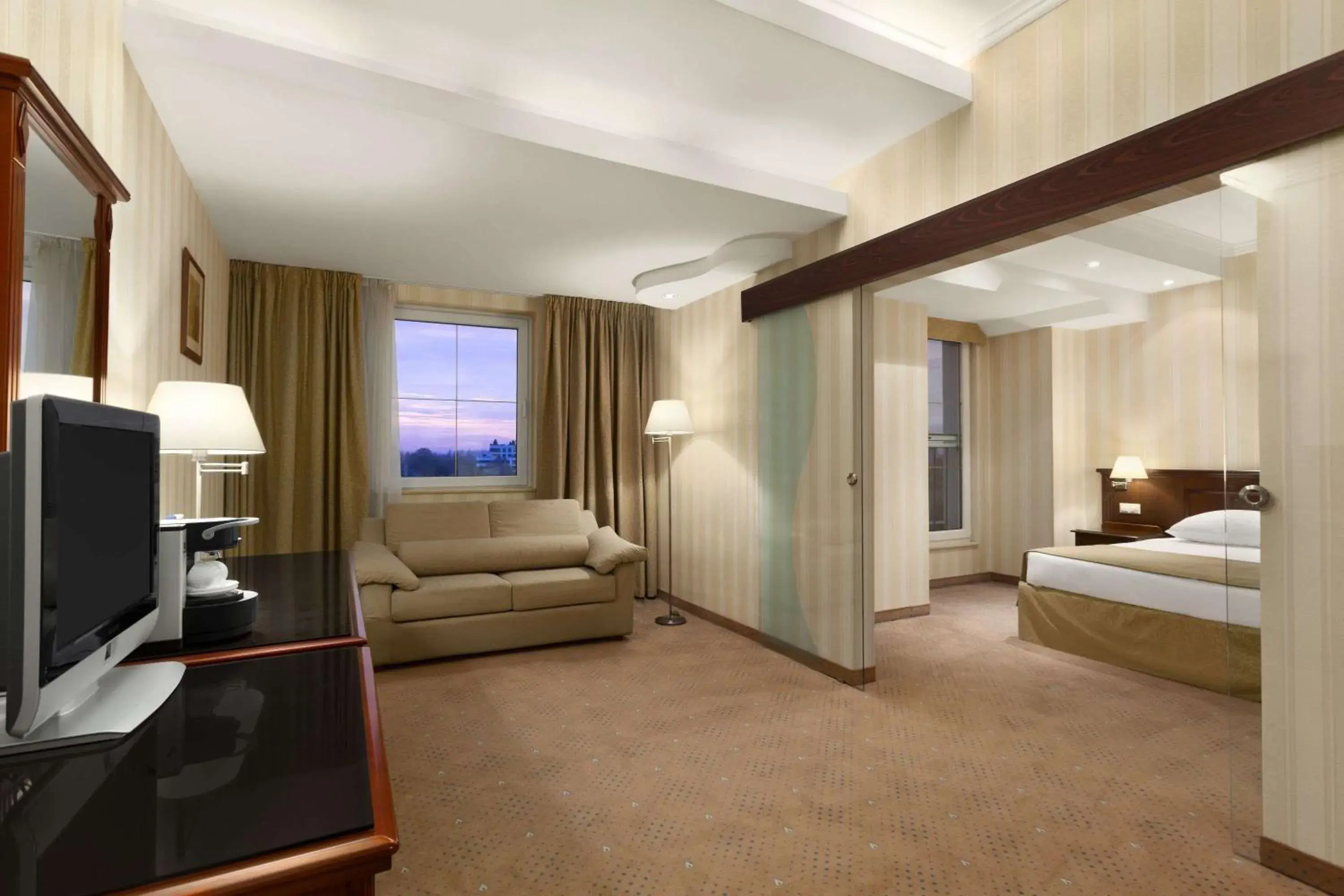 Photo of the whole room, Bed in Ramada Hotel & Suites by Wyndham Bucharest North Photo of the whole room, Bed in Ramada Hotel & Suites by Wyndham Bucharest North