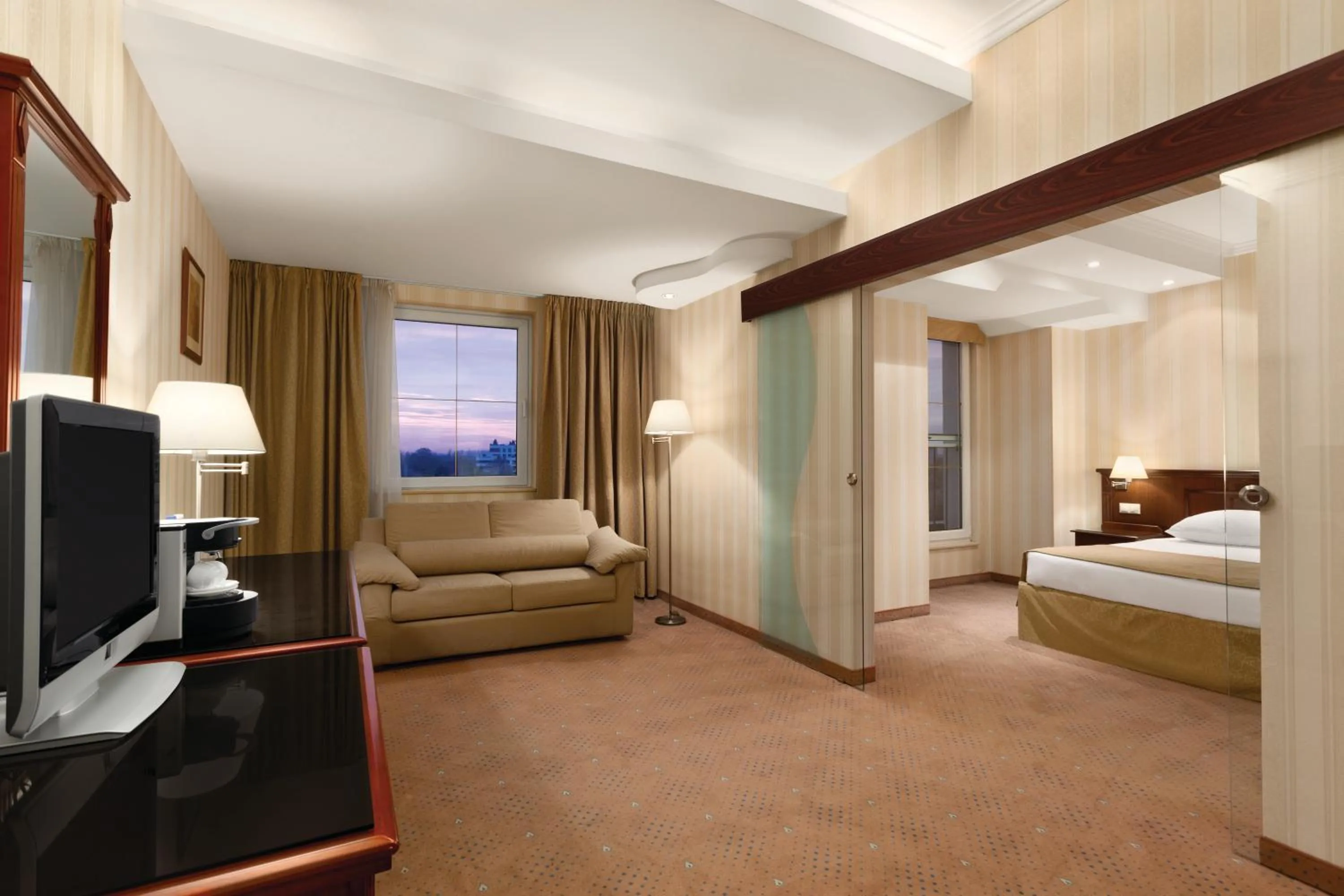 Photo of the whole room, Bed in Ramada Hotel & Suites by Wyndham Bucharest North