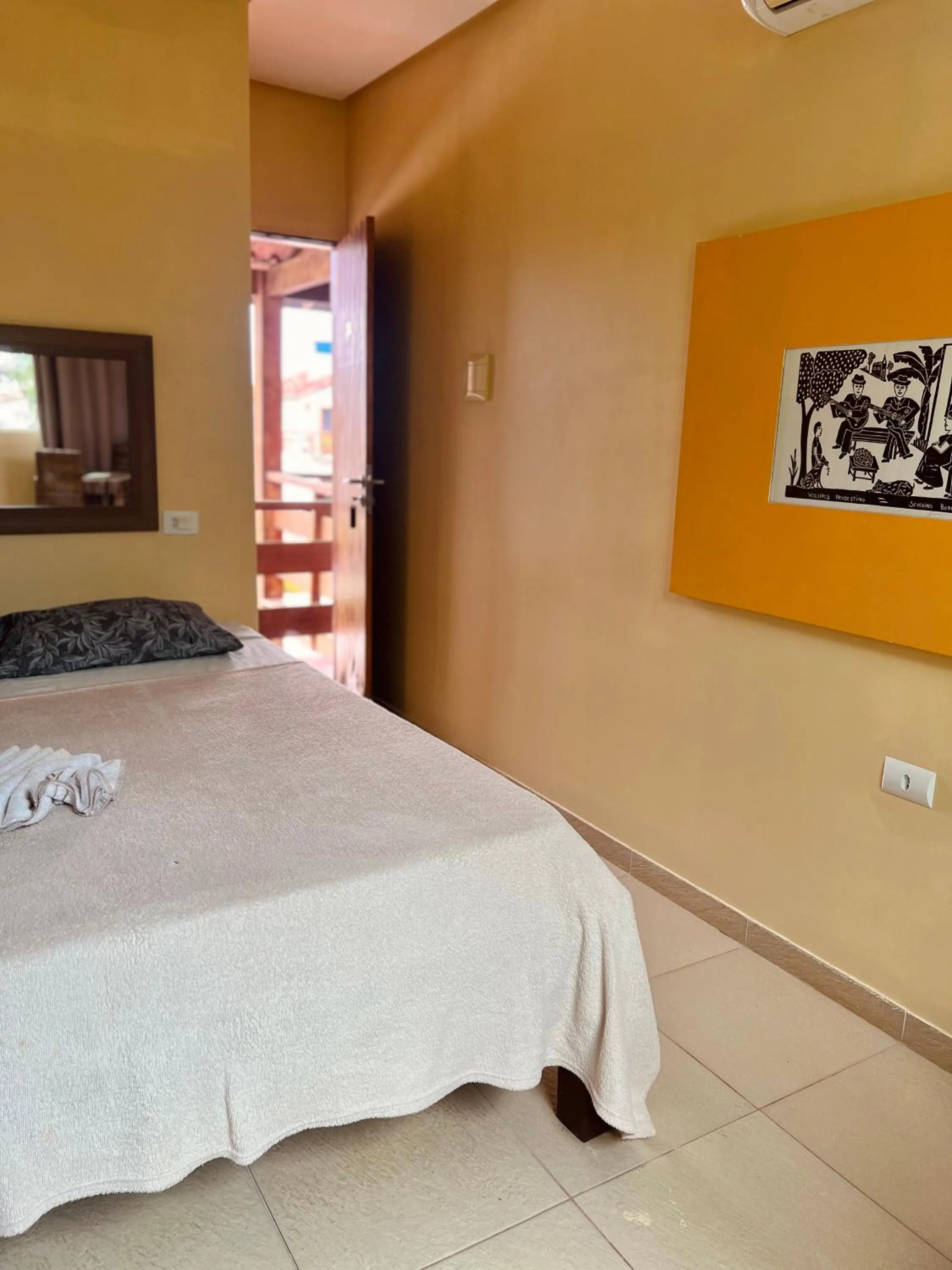 Bed in Pousada Costa Tropical