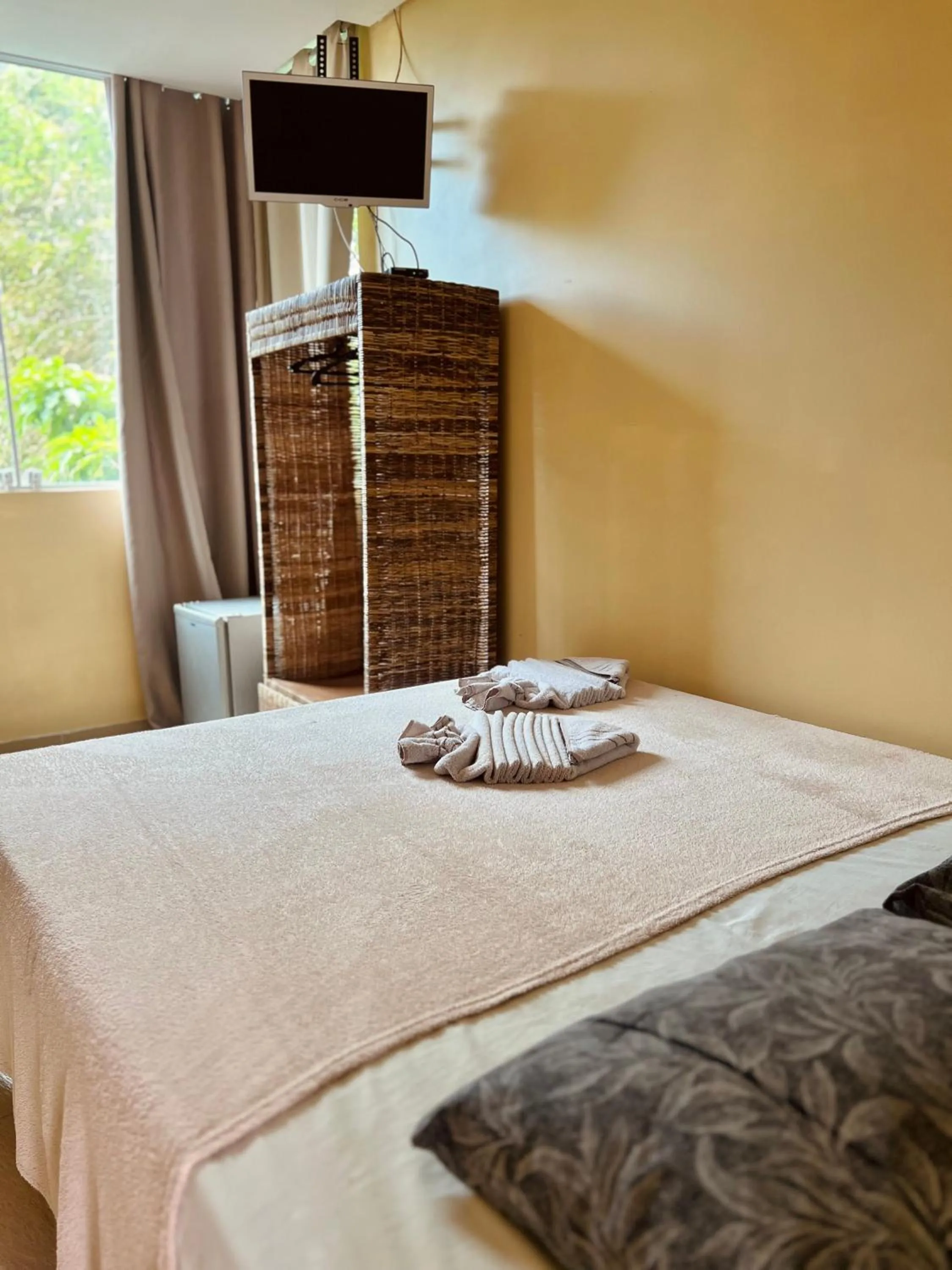 Bed in Pousada Costa Tropical