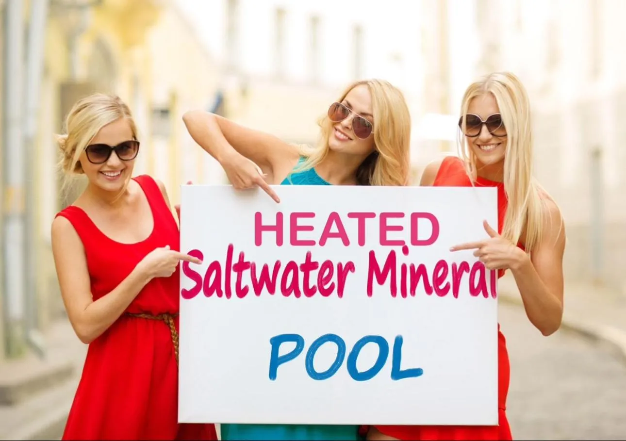 NEW 2026-Ocean Sands Beach Boutique Inn-Sauna and Salt-Mineral Pool -Free Beach Bikes and Famous Beach- Fresh Baked Cookies and Popcorn - Bathrobes and Sunscreen in all rooms-Ultra Sparkling-Free Laundry- 4 Grand Black Beds-Call NOW & Save-1-252-AHA-SAND