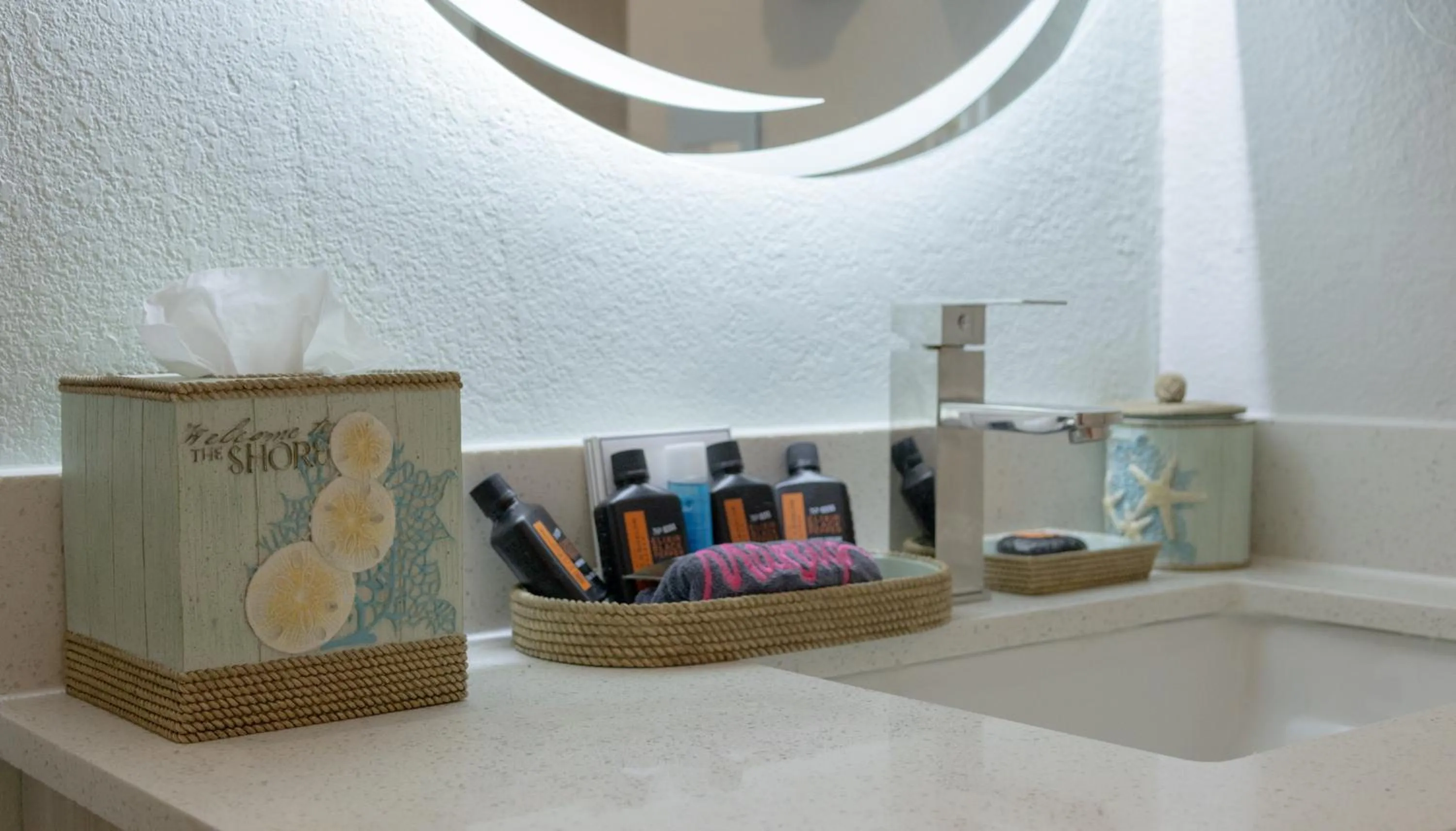 Bathroom in NEW 2026-Ocean Sands Beach Boutique Inn-Sauna and Salt-Mineral Pool -Free Beach Bikes and Famous Beach- Fresh Baked Cookies and Popcorn - Bathrobes and Sunscreen in all rooms-Ultra Sparkling-Free Laundry- 4 Grand Black Beds-Call NOW & Save-1-252-AHA-SAND