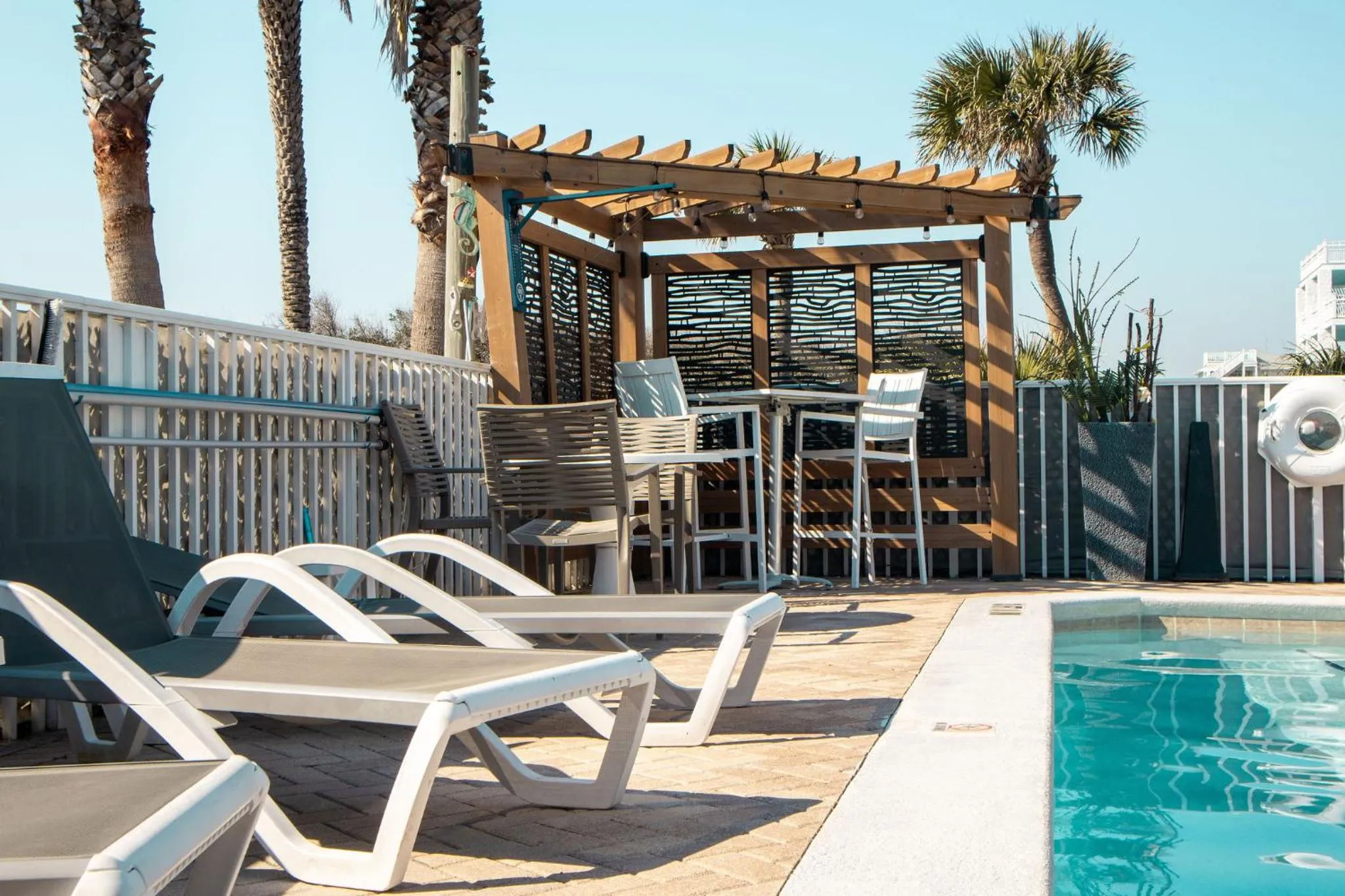 Swimming pool in NEW 2026-Ocean Sands Beach Boutique Inn-Sauna and Salt-Mineral Pool -Free Beach Bikes and Famous Beach- Fresh Baked Cookies and Popcorn - Bathrobes and Sunscreen in all rooms-Ultra Sparkling-Free Laundry- 4 Grand Black Beds-Call NOW & Save-1-252-AHA-SAND