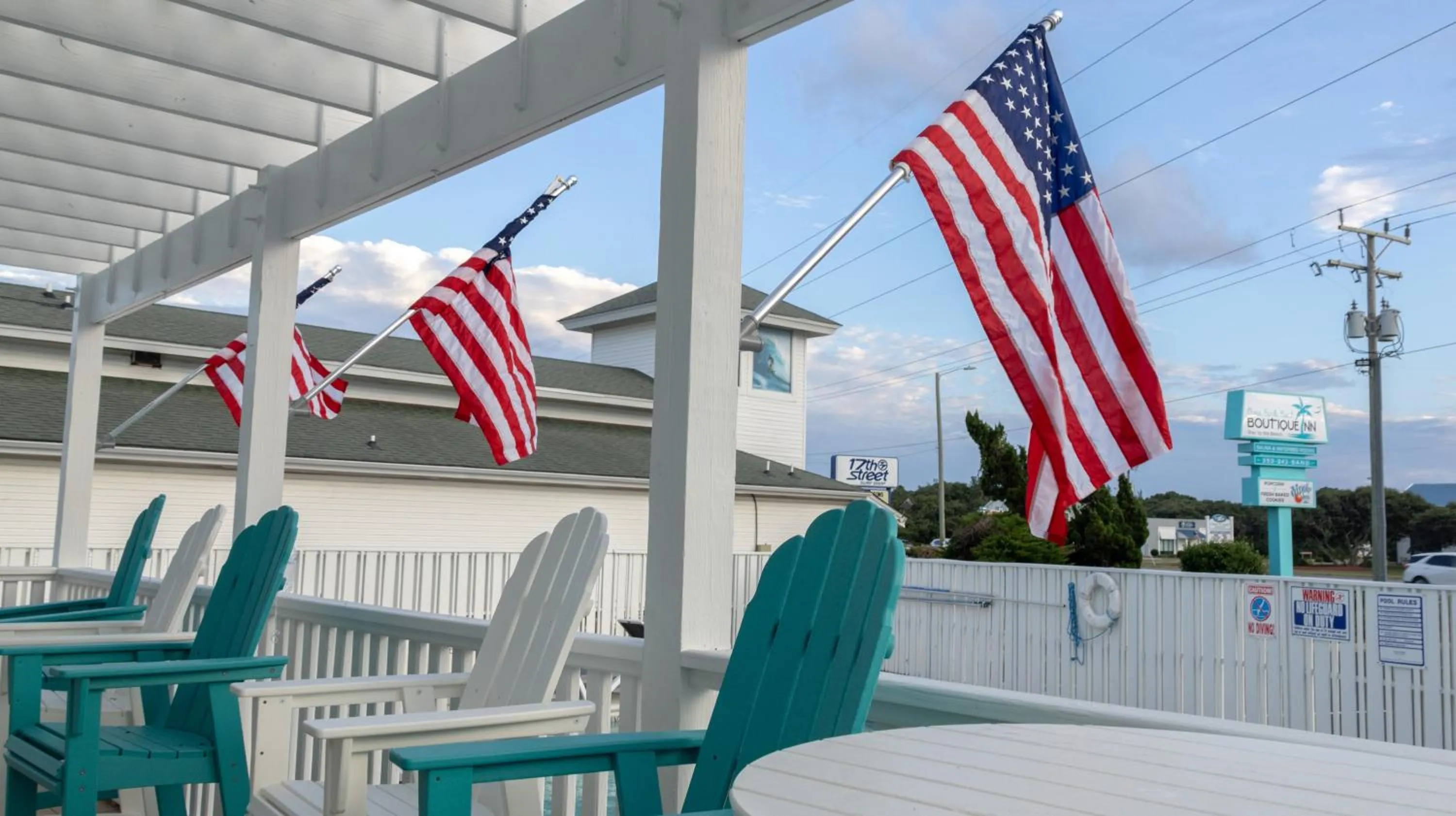 Property building in NEW 2026-Ocean Sands Beach Boutique Inn-Sauna and Salt-Mineral Pool -Free Beach Bikes and Famous Beach- Fresh Baked Cookies and Popcorn - Bathrobes and Sunscreen in all rooms-Ultra Sparkling-Free Laundry- 4 Grand Black Beds-Call NOW & Save-1-252-AHA-SAND