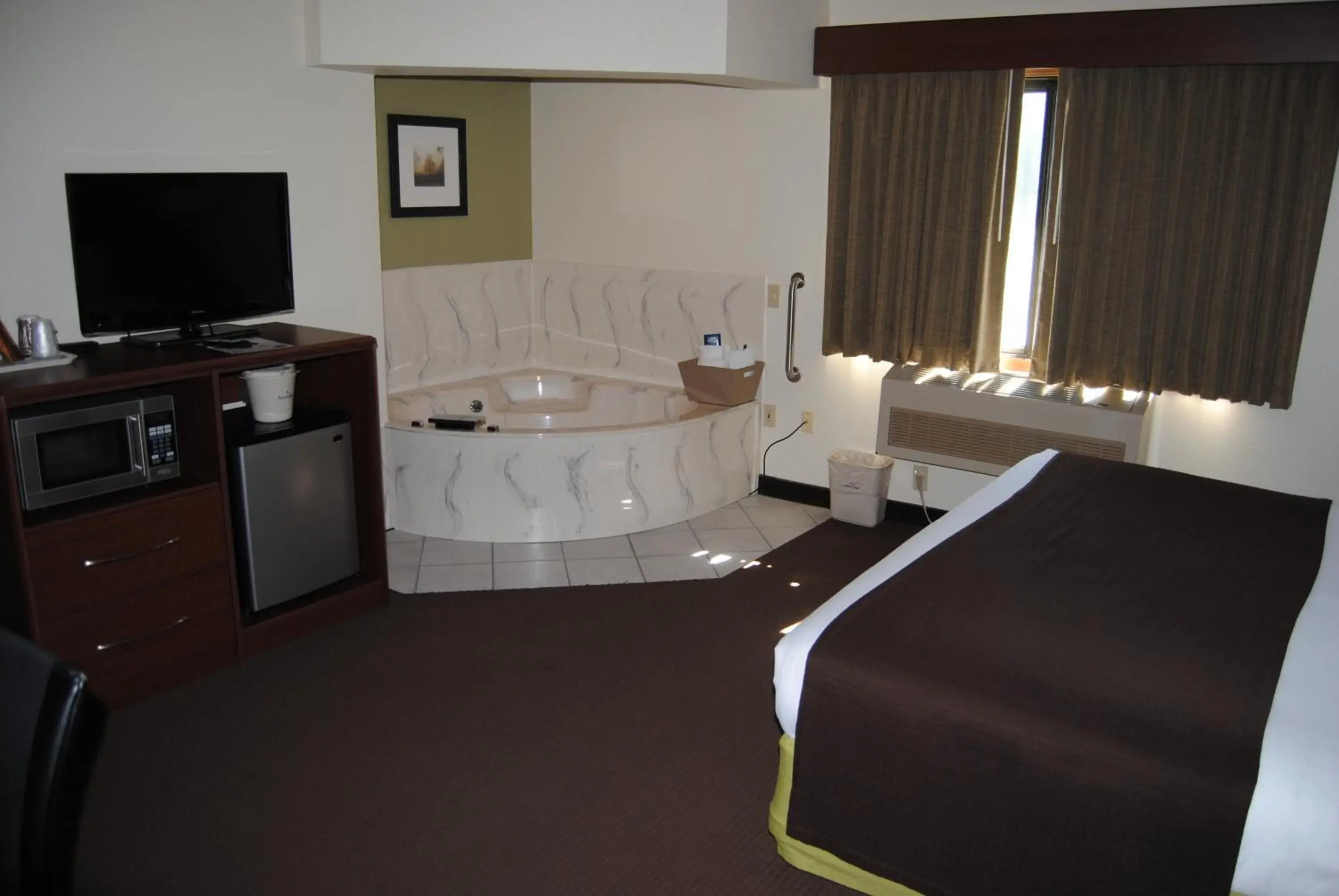 Bed in AmericInn by Wyndham Grand Rapids Bed in AmericInn by Wyndham Grand Rapids