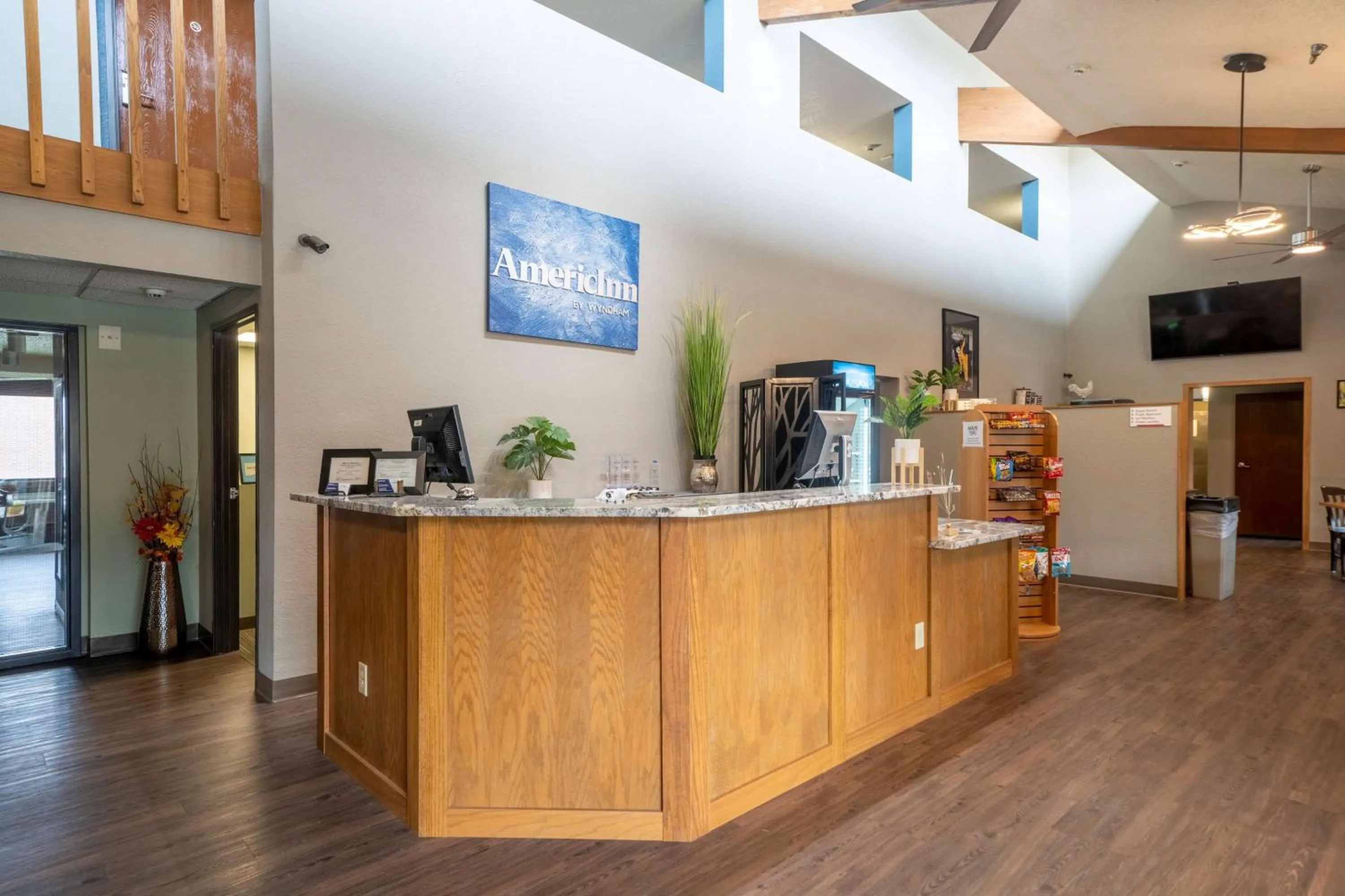 Lobby or reception in AmericInn by Wyndham Grand Rapids