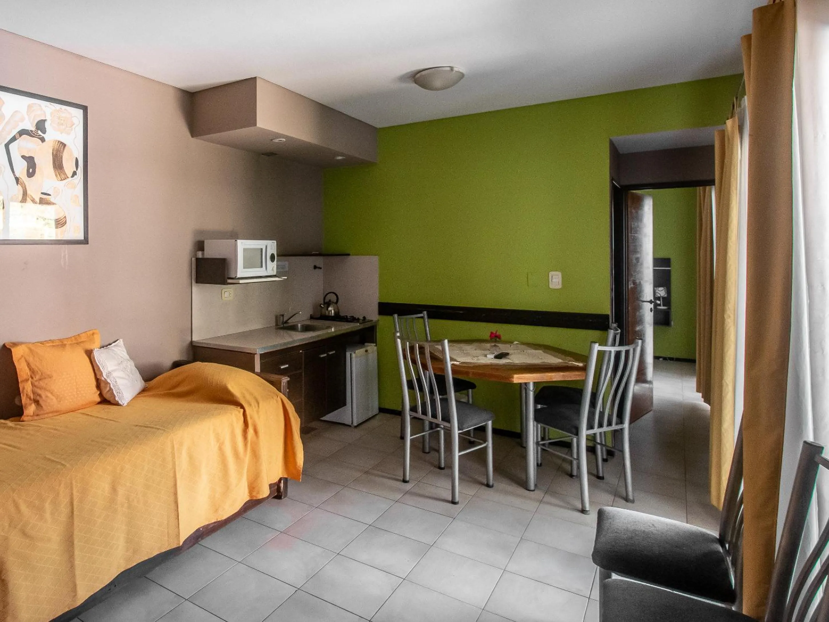 Dining area, Bed in Paradise Departamentos