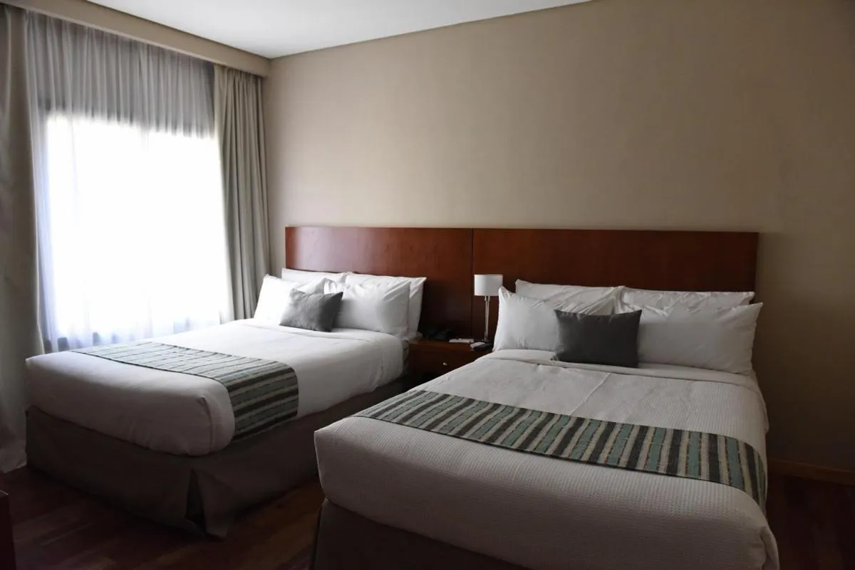 Photo of the whole room, Bed in Howard Johnson Resort & Spa Escobar