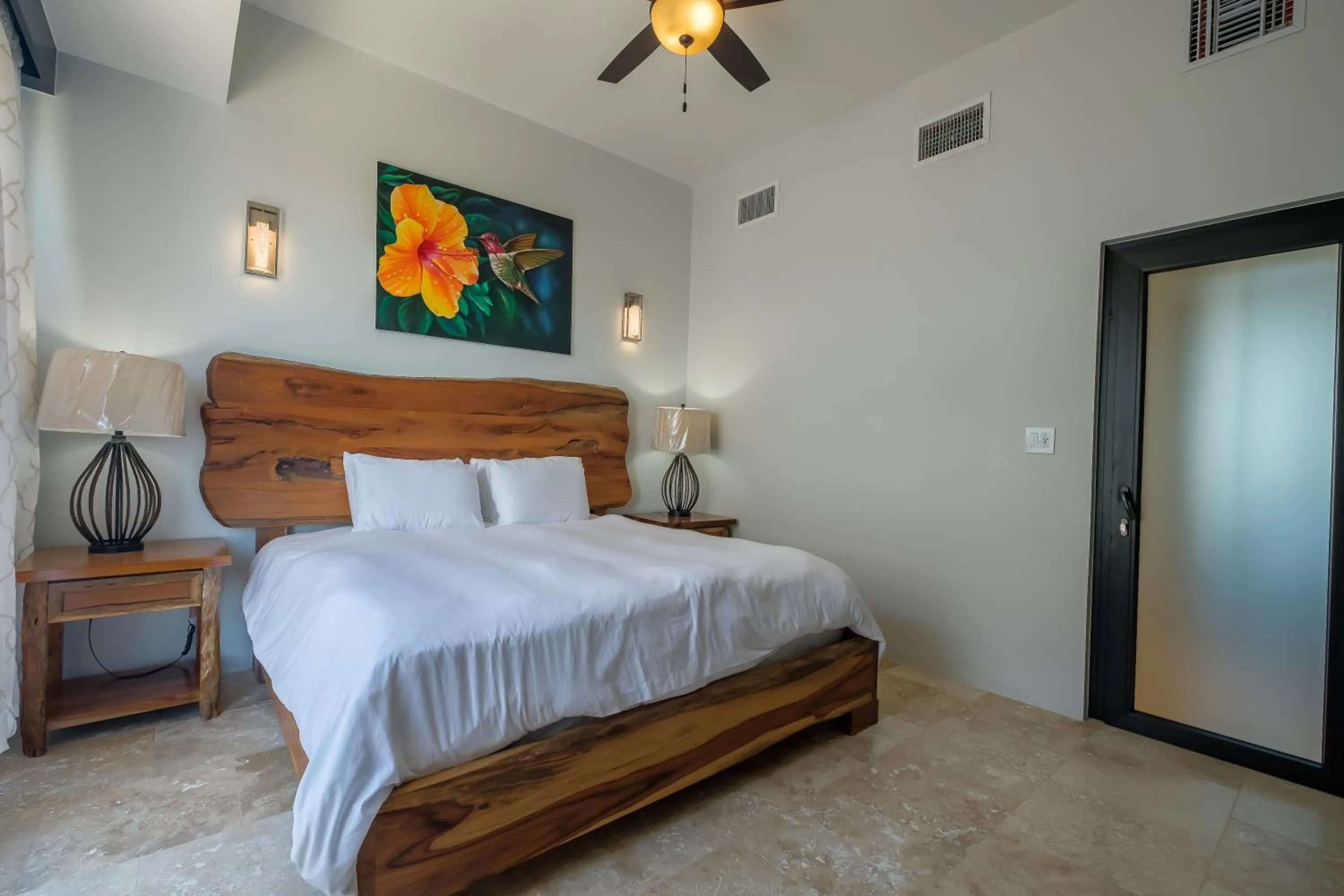 Bed in Diamante Beachfront Suites