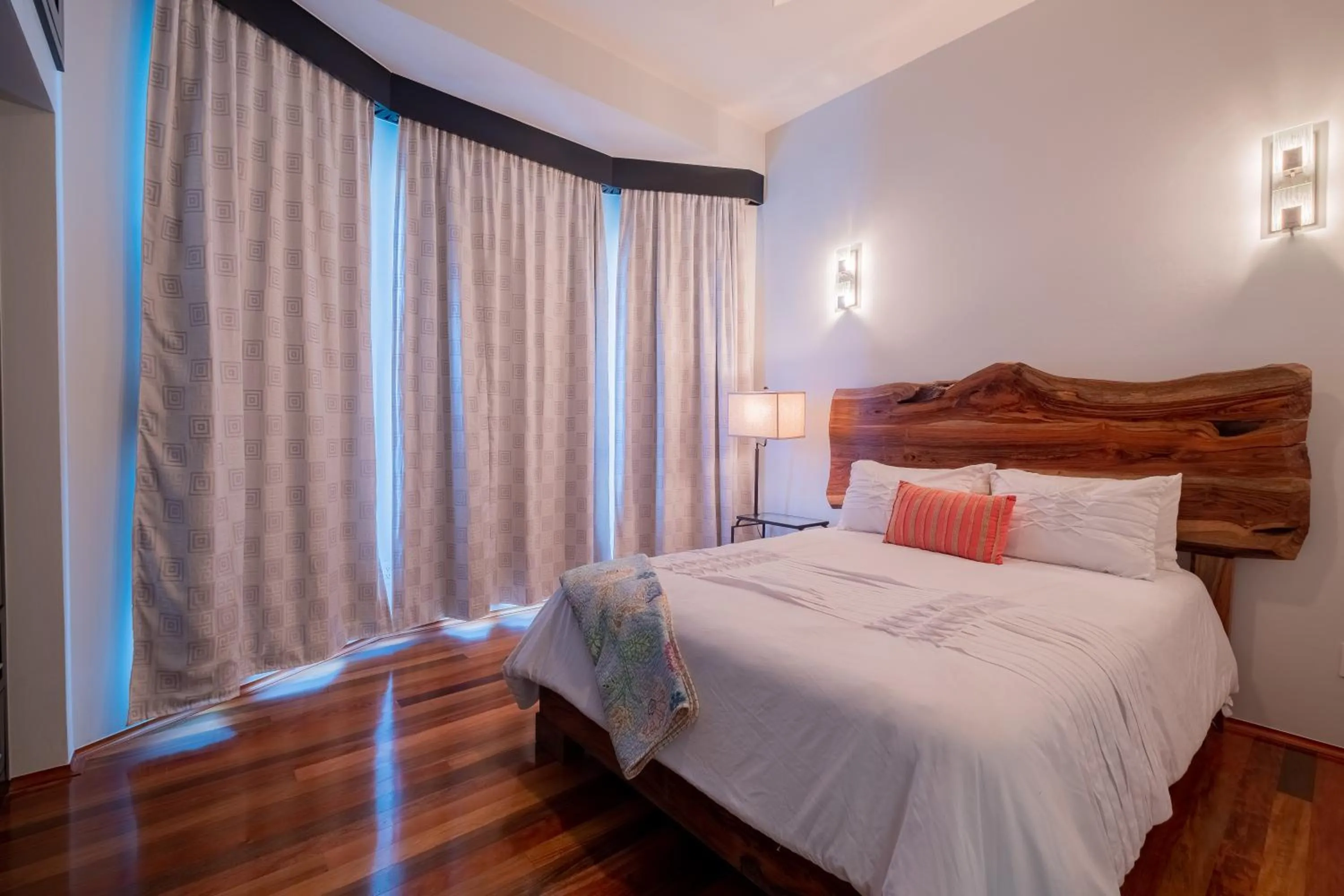 Bed in Diamante Beachfront Suites