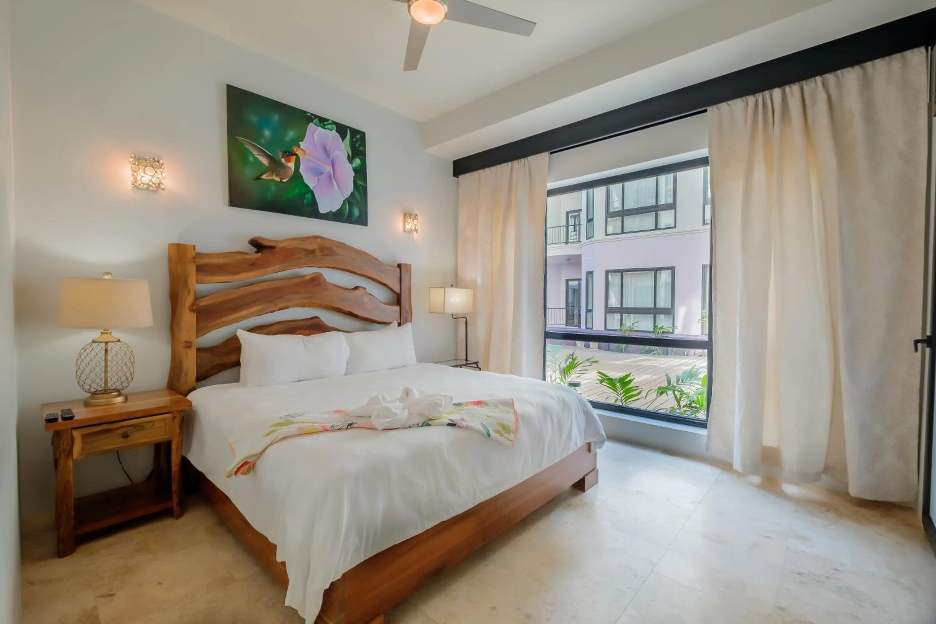 Bed in Diamante Beachfront Suites