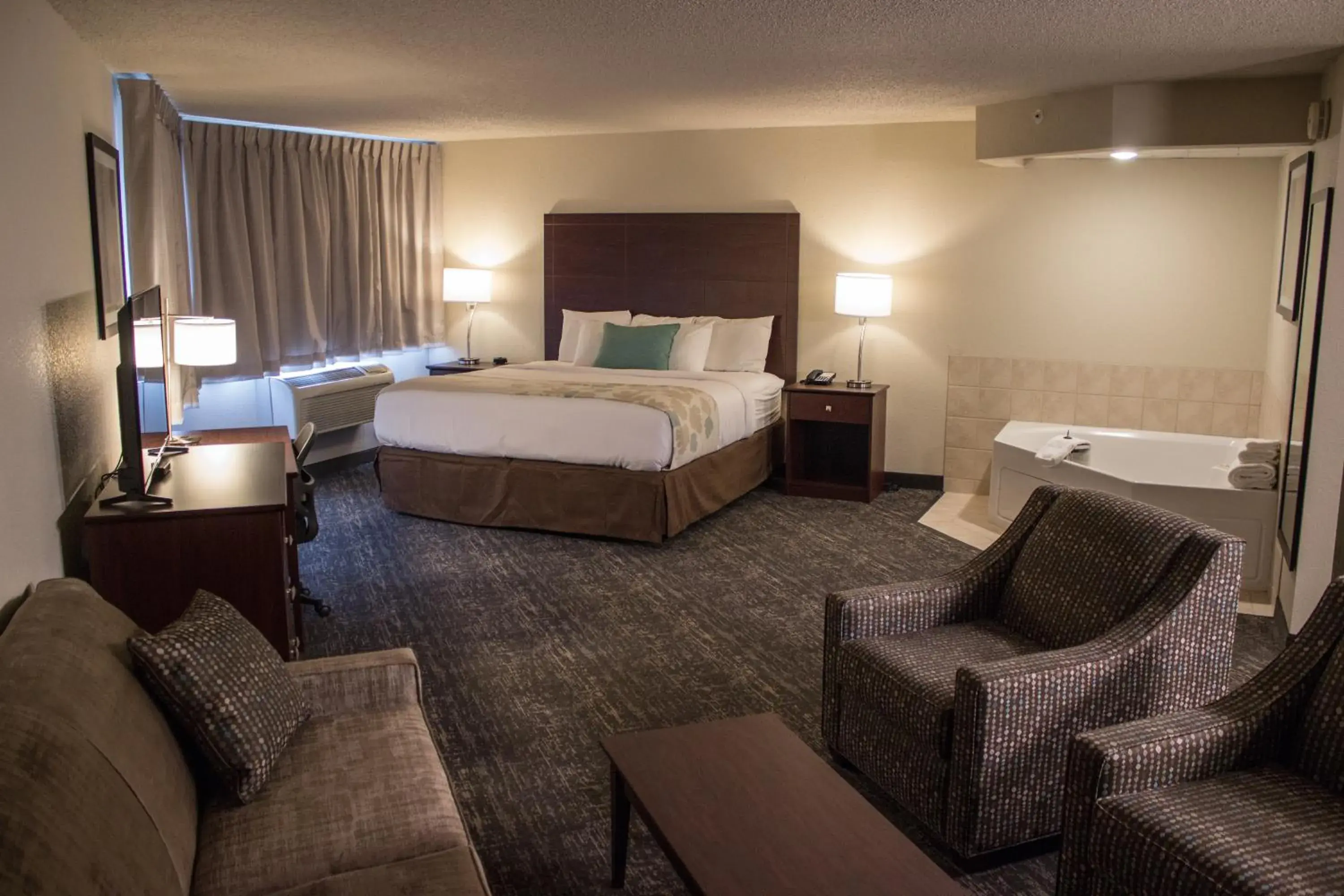 Photo of the whole room, Bed in Cobblestone Suites - Oshkosh Photo of the whole room, Bed in Cobblestone Suites - Oshkosh