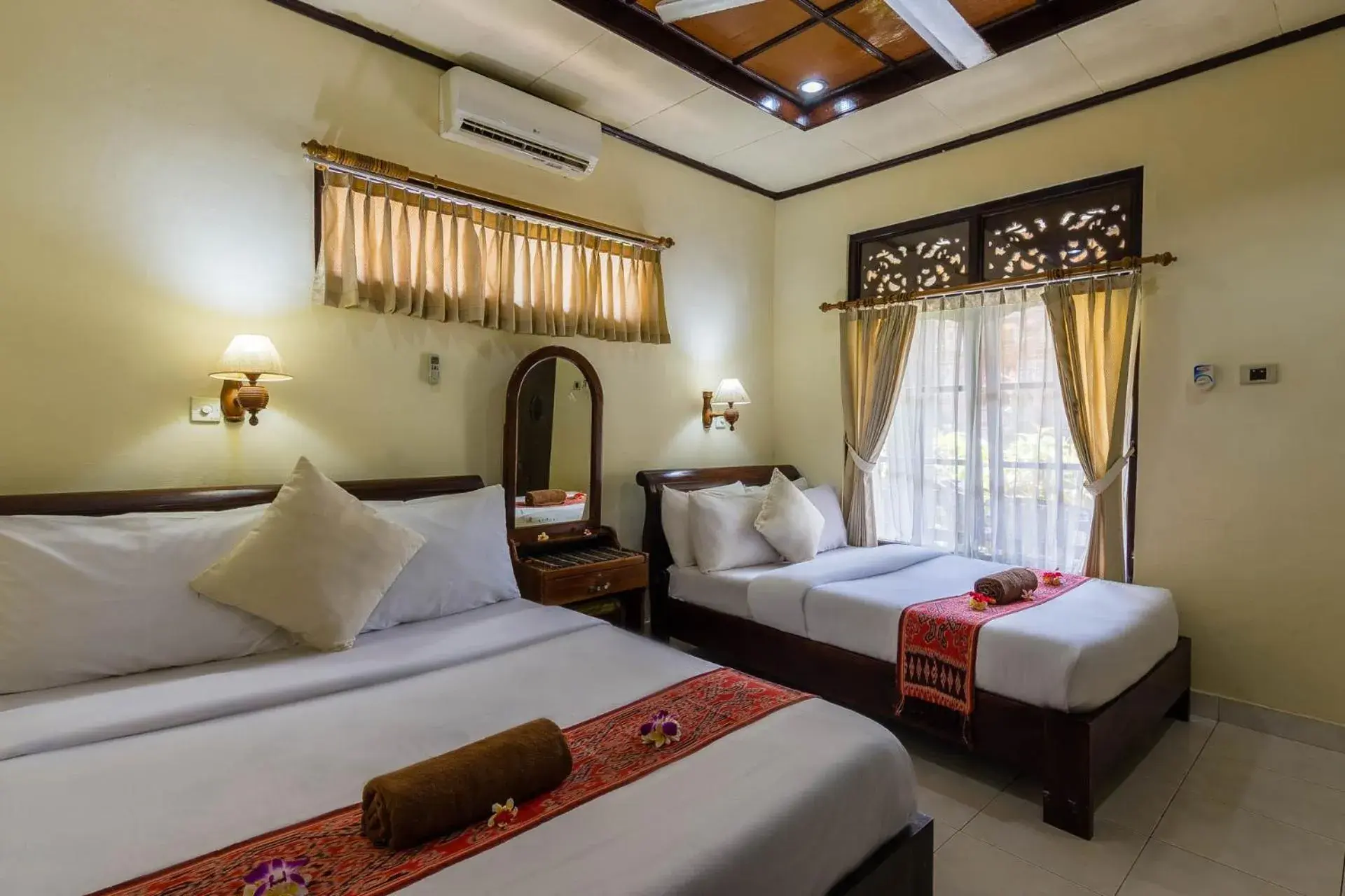 Standard Triple Room Bedroom in Sagitarius Inn Standard Triple Room Bedroom in Sagitarius Inn