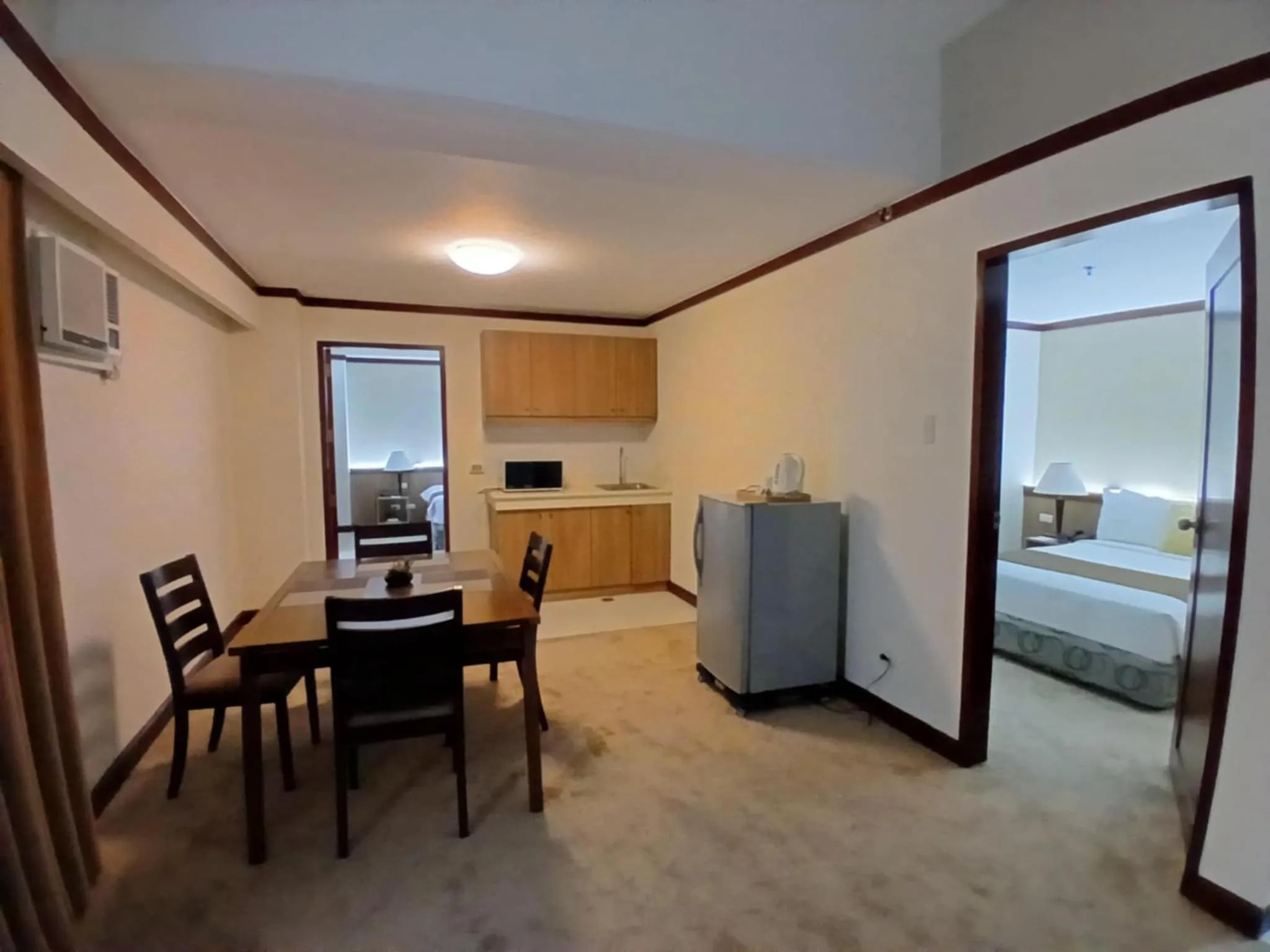 Kitchen or kitchenette, Bed in Dohera Hotel