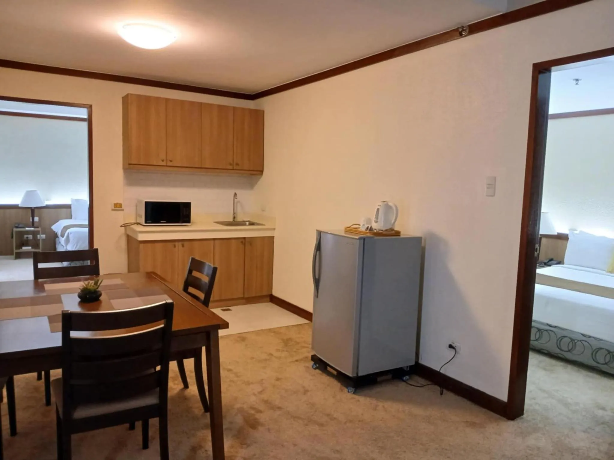 Kitchen or kitchenette, Bed in Dohera Hotel