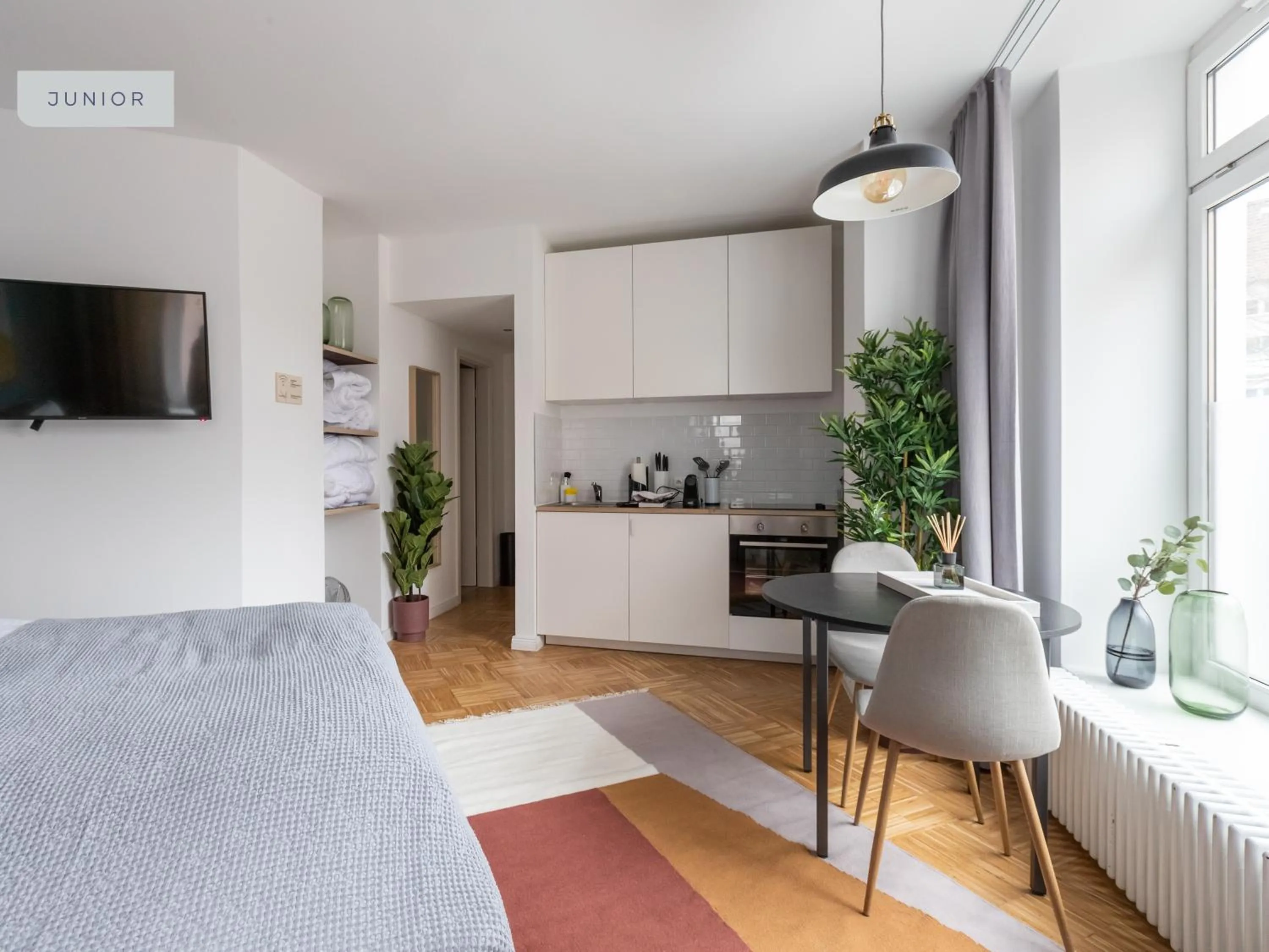 Kitchen or kitchenette, Bed in Apartments Berlin Aroser Allee