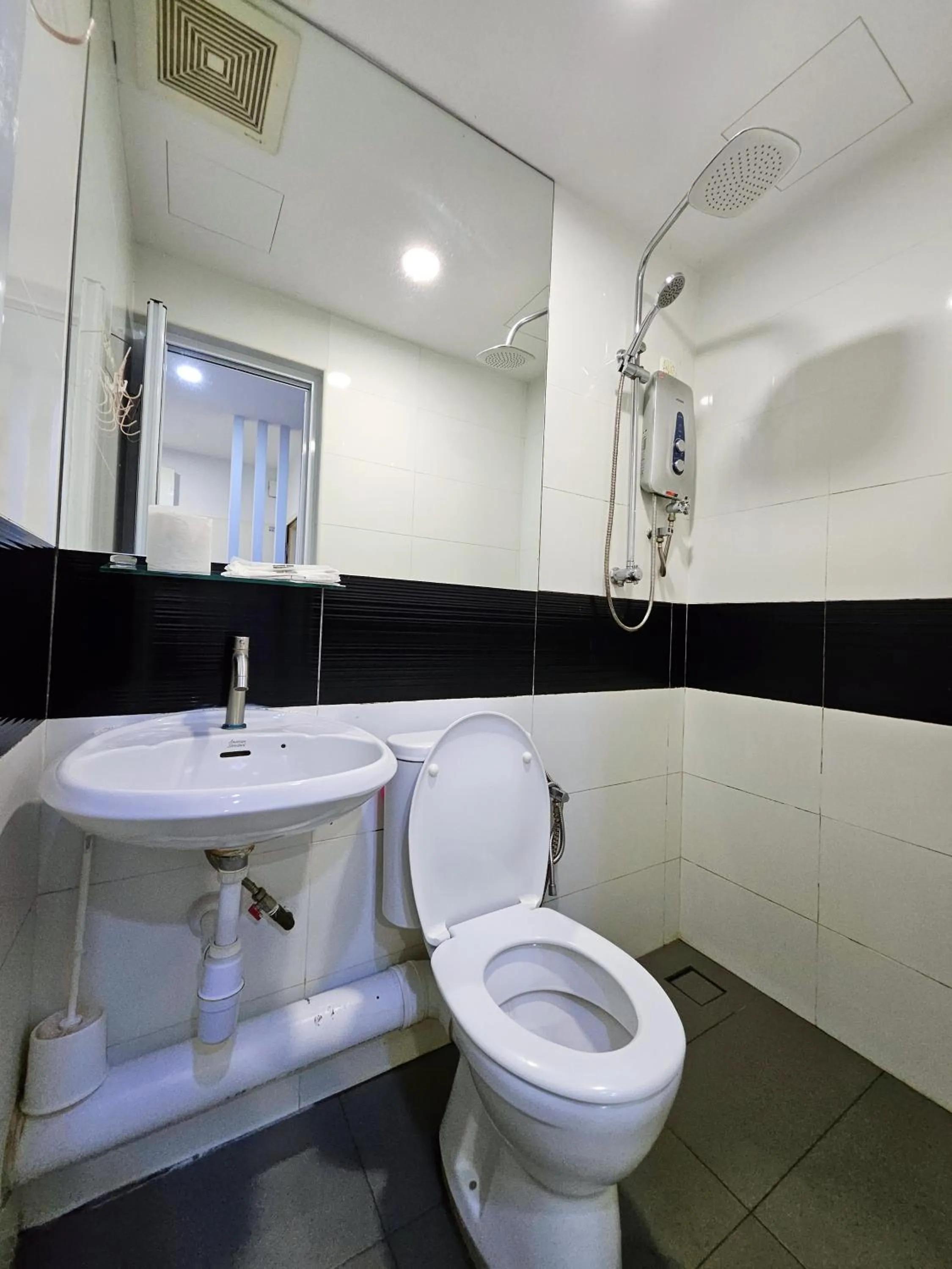 Toilet in Mansion One by Sky Hive