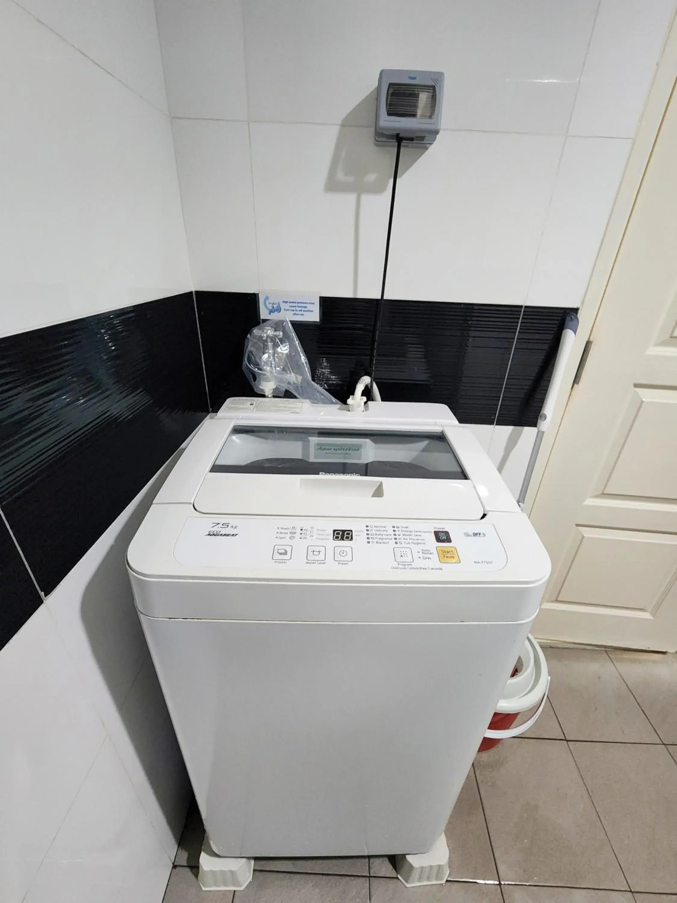 washing machine in Mansion One by Sky Hive washing machine in Mansion One by Sky Hive